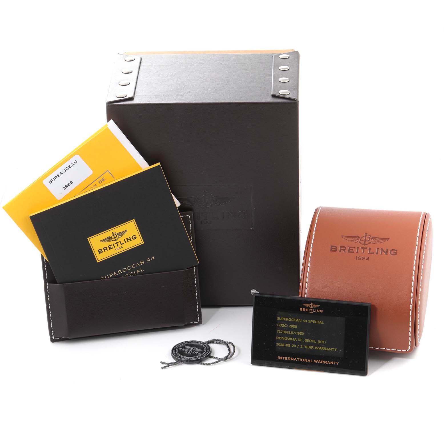 The image shows a Breitling Superocean Y1739310 Men's Stainless Steel Blue Dial Y1739310 Men's Stainless Steel Blue Dial watch box, warranty card, manuals, and a leather travel case.