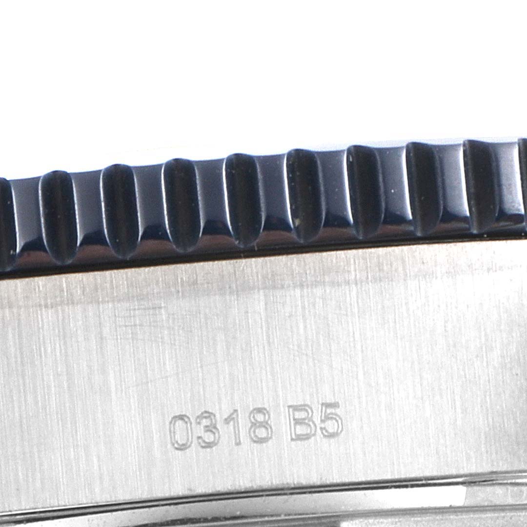This close-up image shows the side profile of the bezel and part of the case of a Breitling Superocean Y1739310 Men's Stainless Steel Blue Dial Y1739310 Men's Stainless Steel Blue Dial watch.