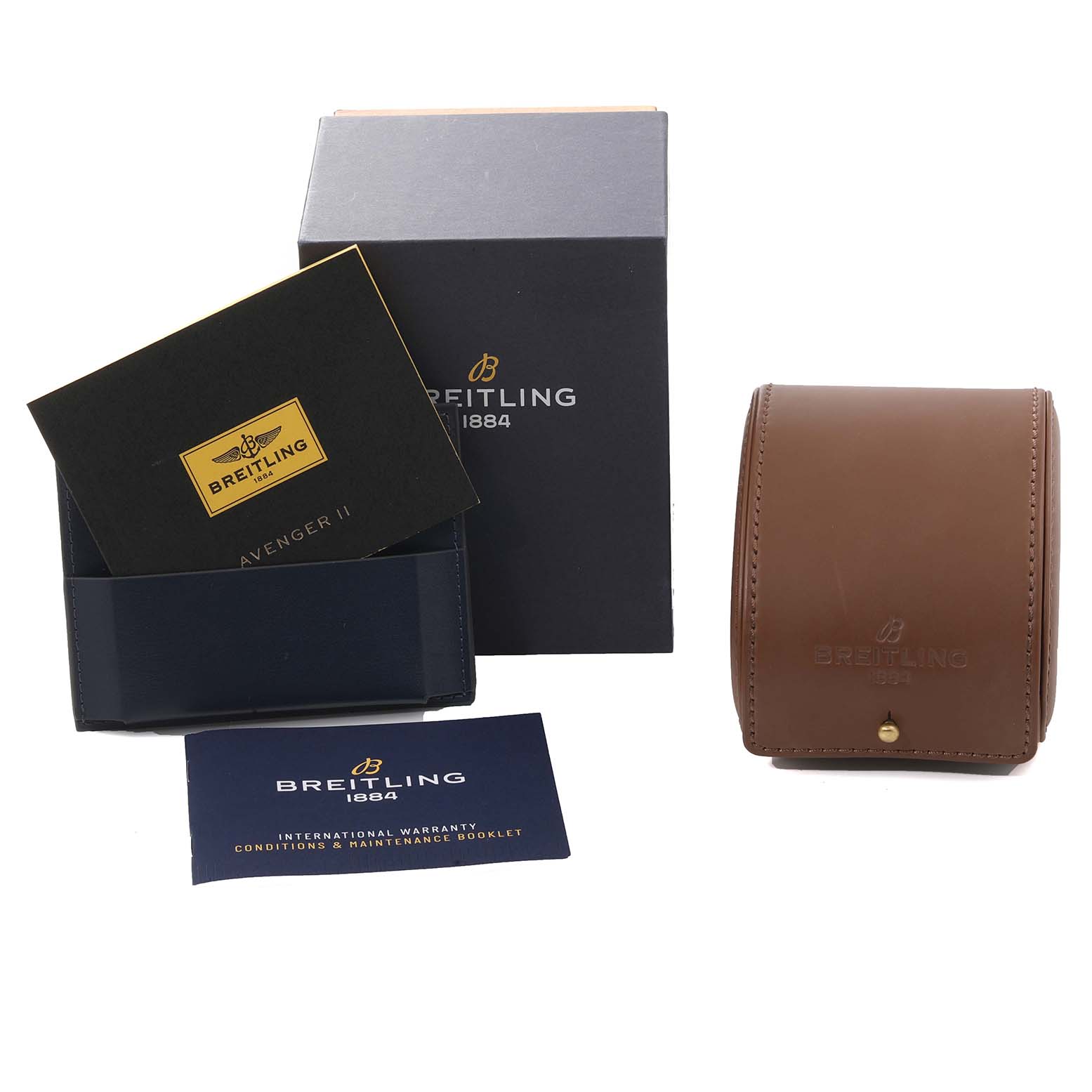 The image shows a Breitling Avenger A13381 Men's Stainless Steel Mother of Pearl Dial A13381 Men's Stainless Steel Mother of Pearl Dial watch box, warranty booklet, and a brown leather travel case.