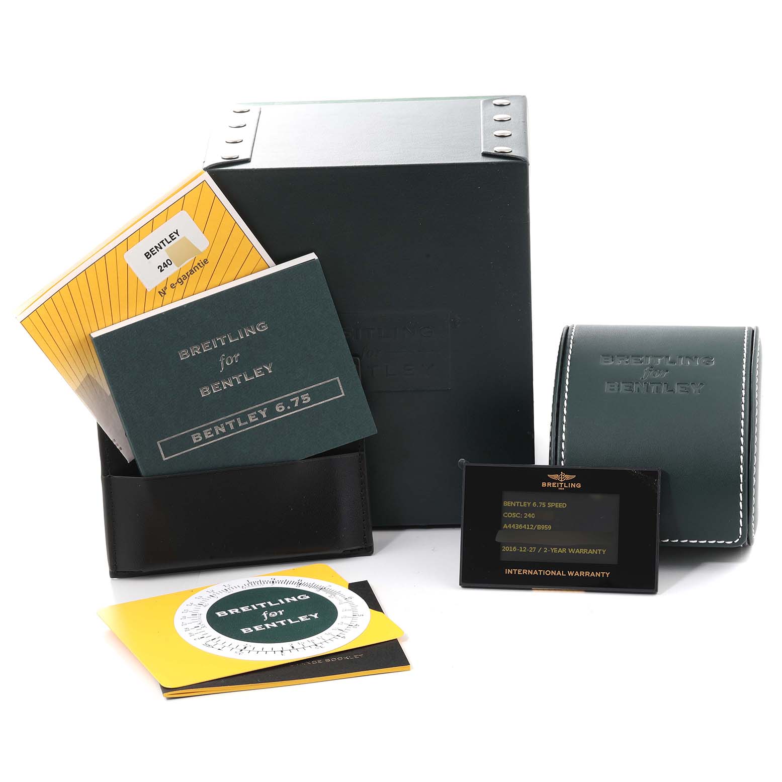 The image shows the packaging and accessories for the Bentley model by Breitling, including manuals, a warranty card, and a watch case.