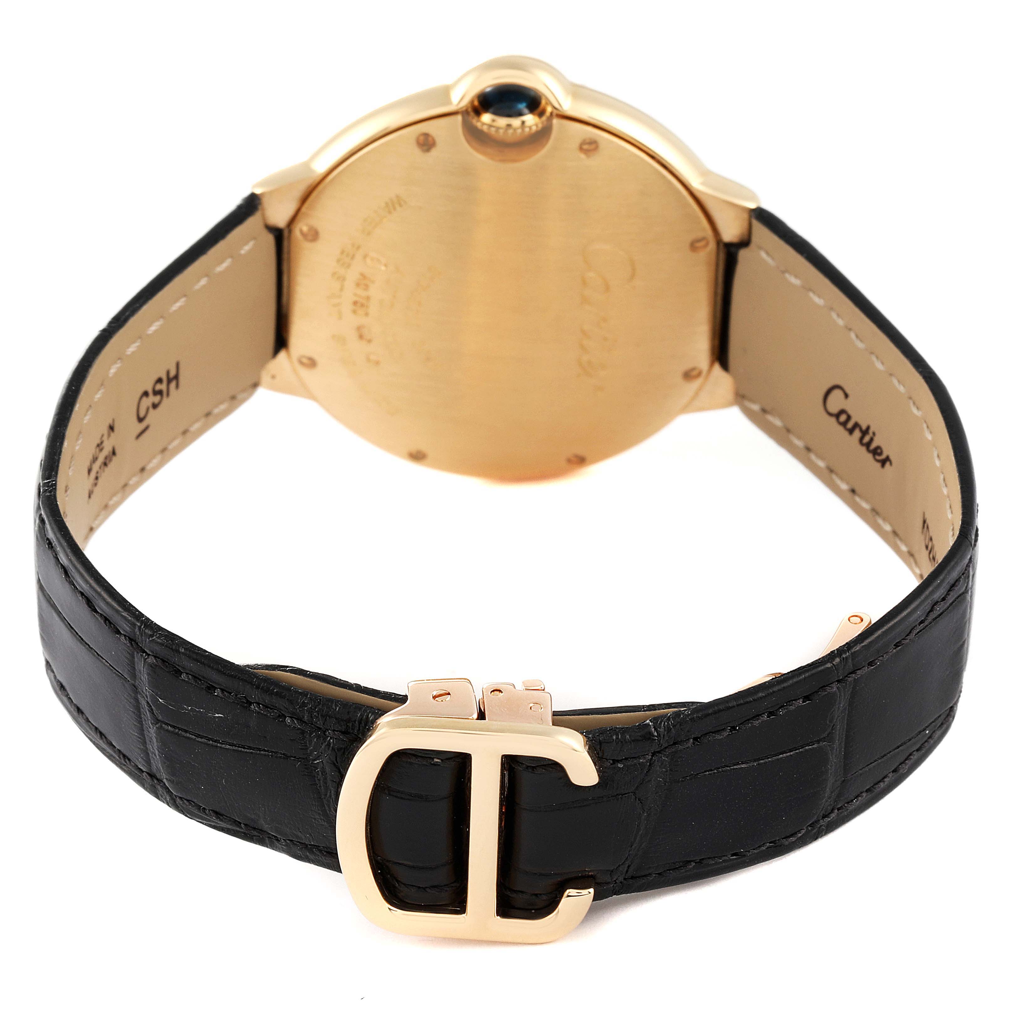 The image shows the back of a Cartier Ballon Bleu WE900451 Men's Yellow Gold Silver Dial WE900451 Men's Yellow Gold Silver Dial watch, highlighting its case and black leather strap with a gold buckle.