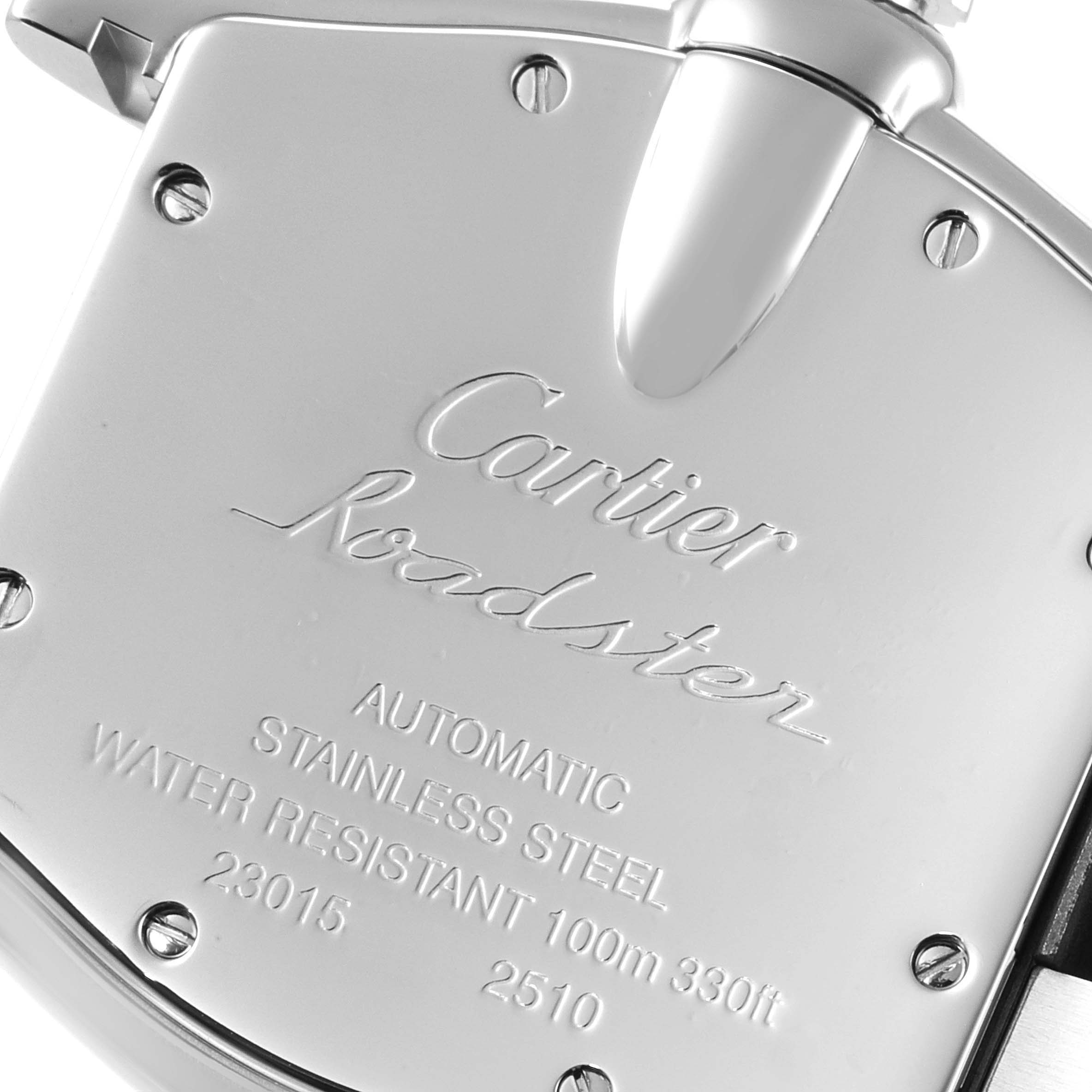 The image shows the back case of a Cartier Roadster W62025V3 Men
s Stainless Steel Silver Dial W62025V3 Men
s Stainless Steel Silver Dial watch, highlighting its engravings and screws.
