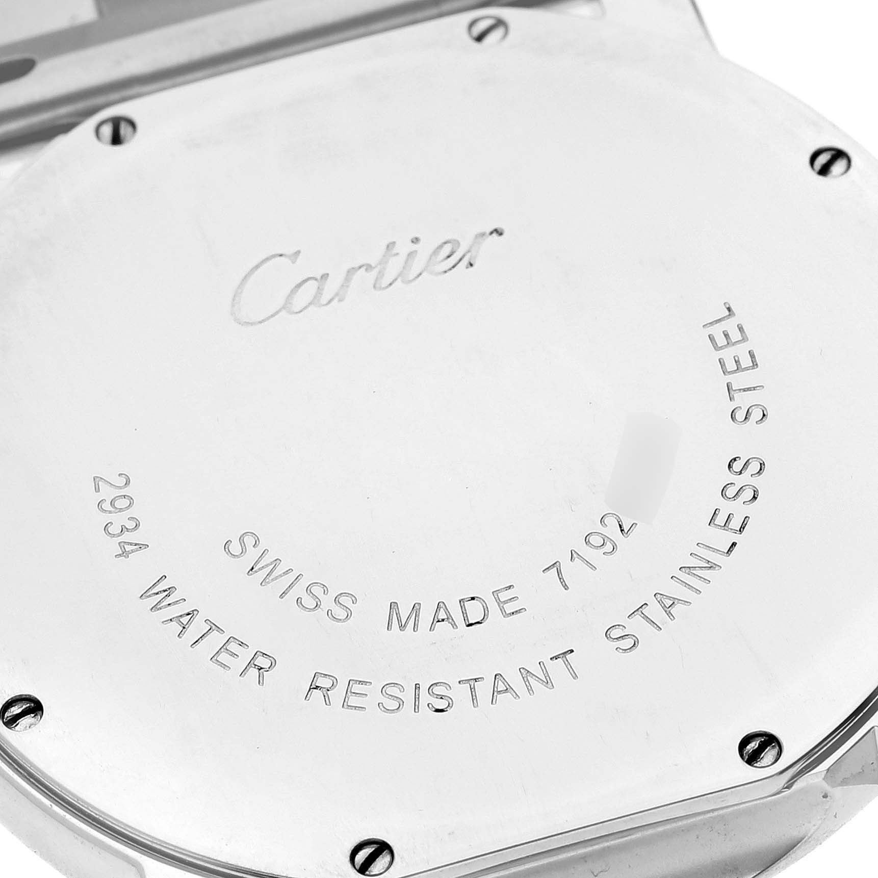 The image shows the case back of a Ronde model by Cartier, displaying inscriptions and screws.