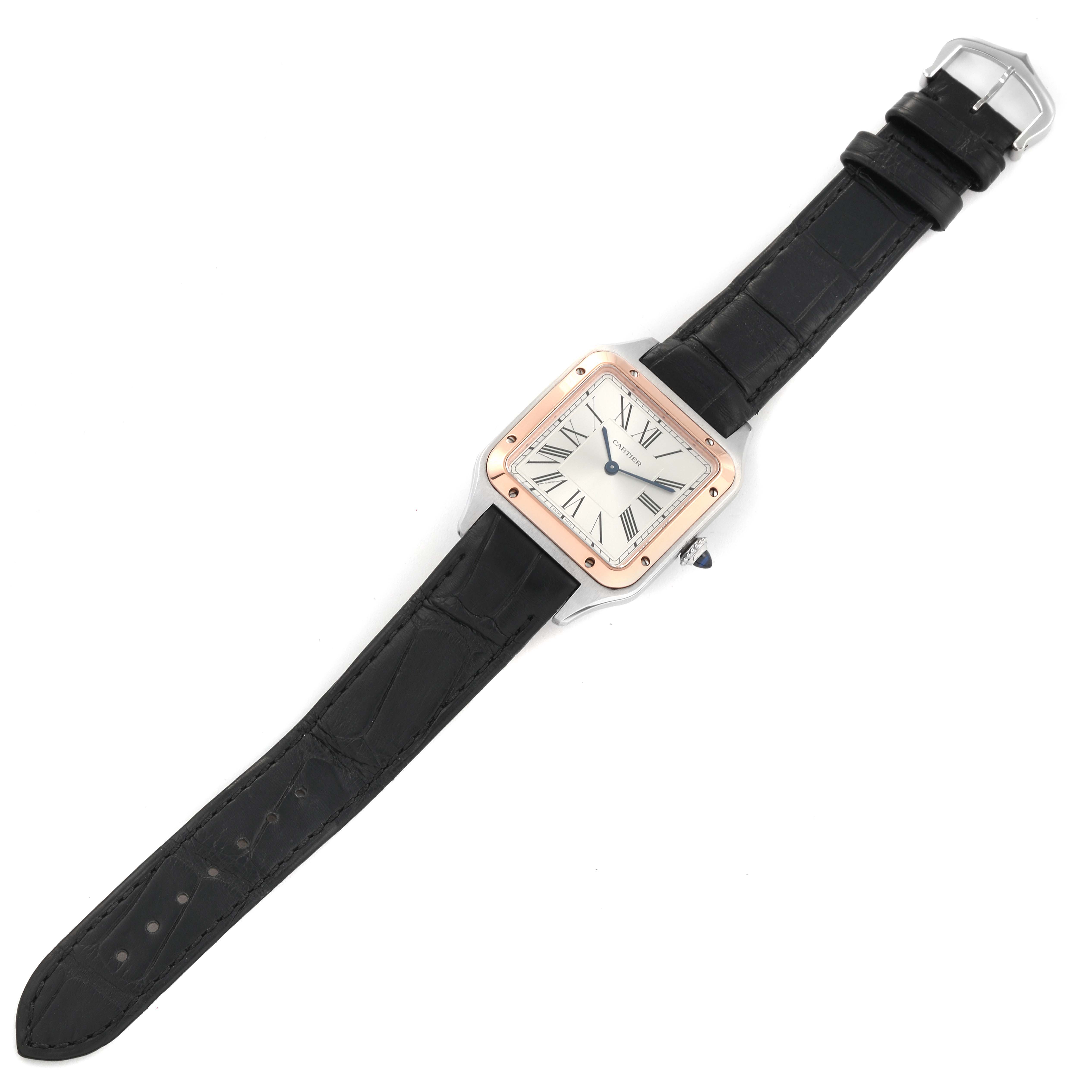 This image shows a Cartier Santos Dumont W2SA0011 Men's Steel and Gold (two tone) Silver Dial W2SA0011 Men's Steel and Gold (two tone) Silver Dial watch from a top-down angle, highlighting its face, case, and leather strap.