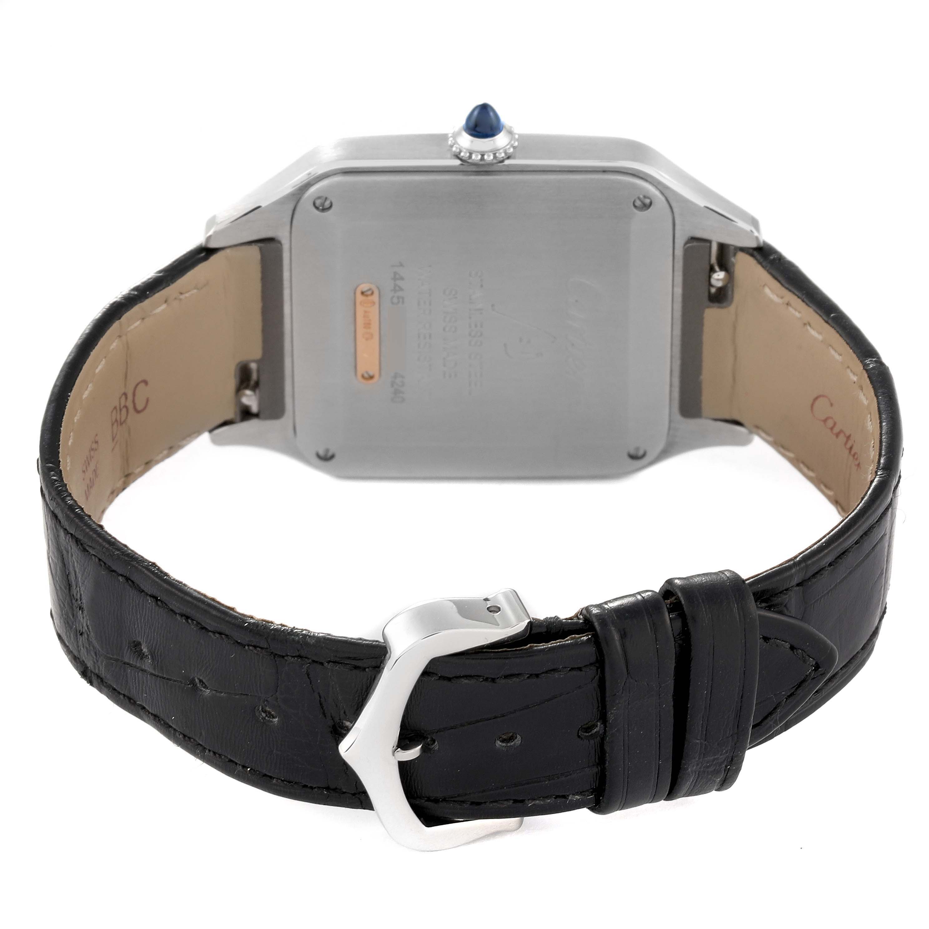 The image shows the back view of a Santos Dumont model by Cartier, highlighting the case back and black leather strap.