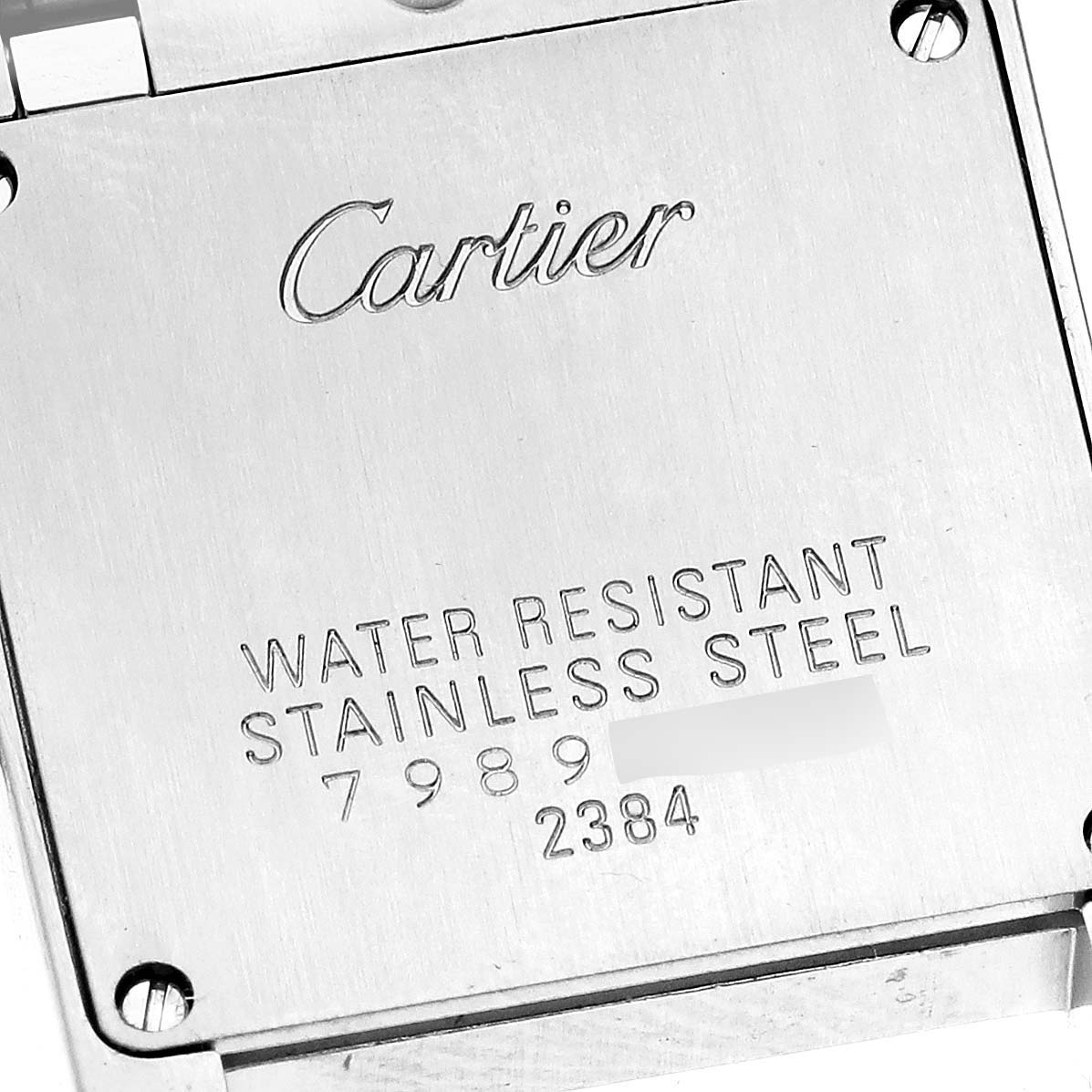 The image shows the back of a Cartier Tank Francaise W51027Q4 Women's Steel and Gold (two tone) Mother of Pearl Dial W51027Q4 Women's Steel and Gold (two tone) Mother of Pearl Dial watch, featuring engraving with the brand name and material information.