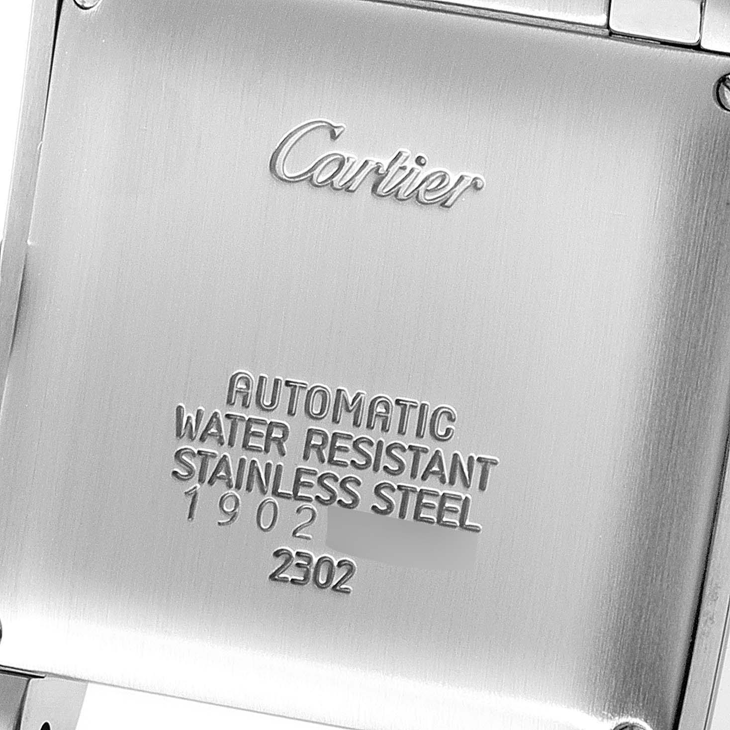 This image shows the back case of a Cartier Tank Francaise W51005Q4 Men's Steel and Gold (two tone) Silver Dial W51005Q4 Men's Steel and Gold (two tone) Silver Dial watch highlighting its engravings and material.