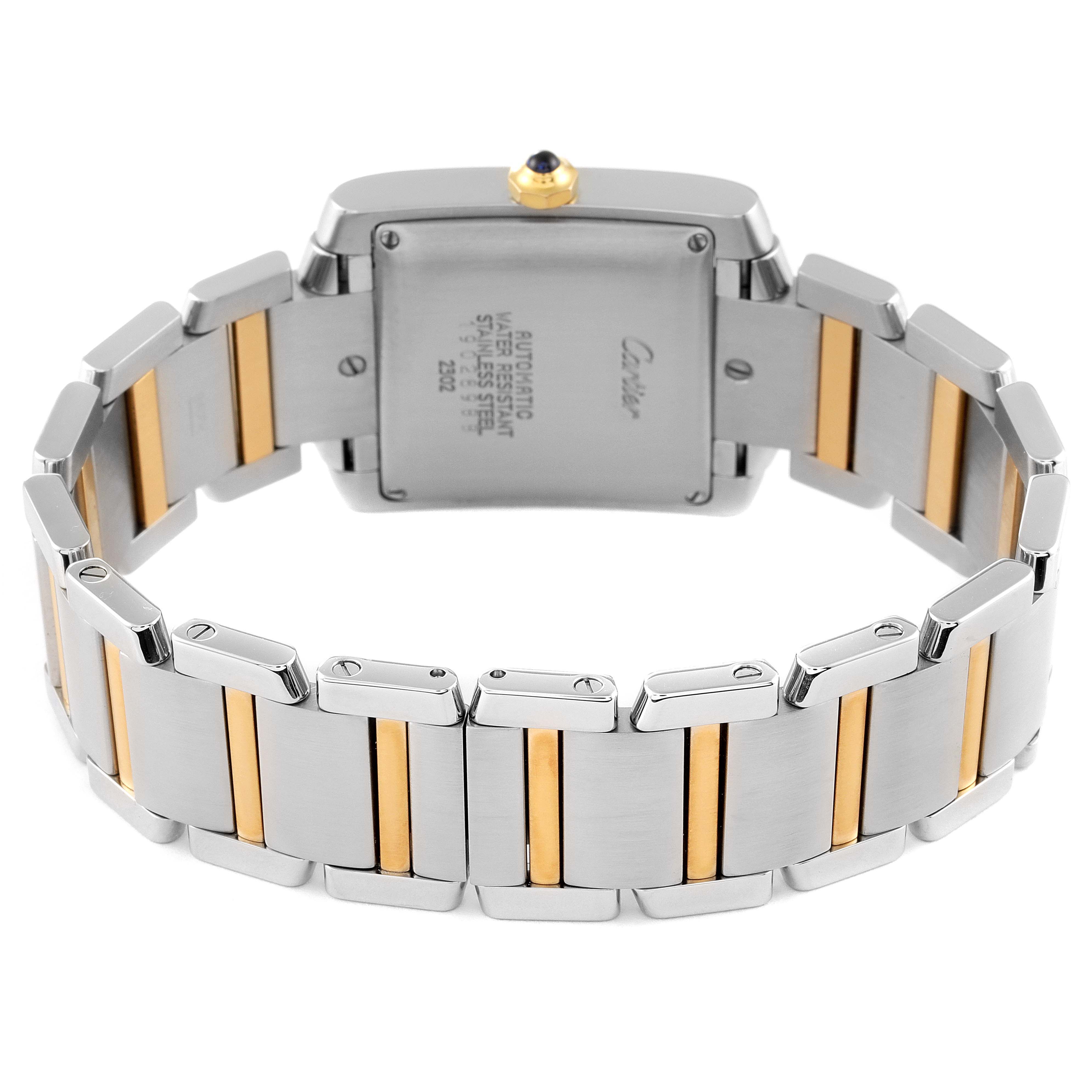 The image shows the backside of a Cartier Tank Francaise W51005Q4 Men's Steel and Gold (two tone) Silver Dial W51005Q4 Men's Steel and Gold (two tone) Silver Dial watch, highlighting its stainless steel and gold bracelet.