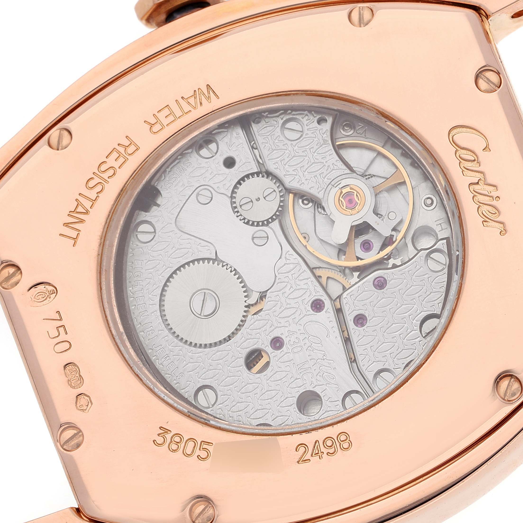The image shows the back view of a Cartier Tortue WA503751 Women's Rose Gold Silver Dial WA503751 Women's Rose Gold Silver Dial watch, highlighting its exposed mechanism and engravings.