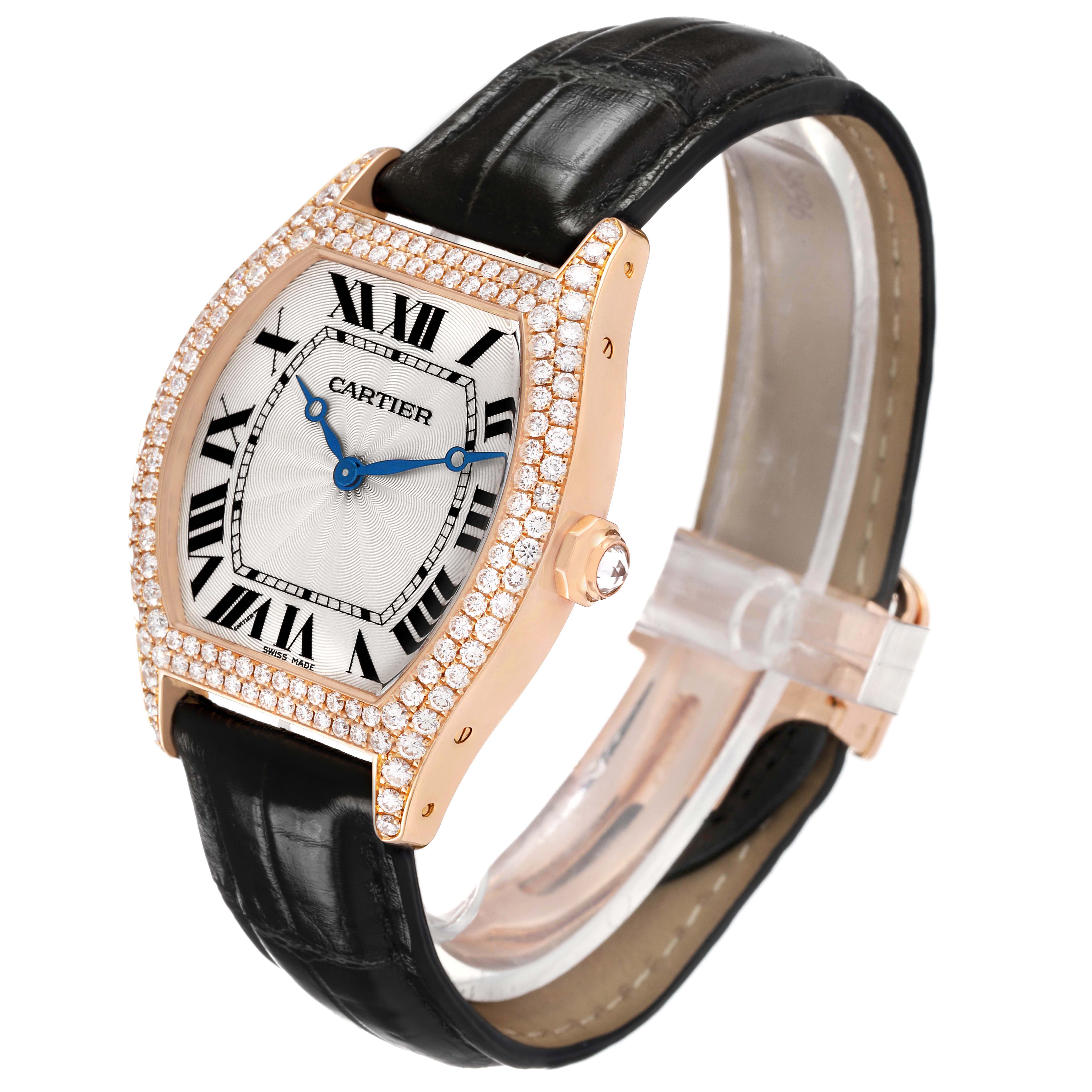The Cartier Tortue WA503751 Women's Rose Gold Silver Dial watch is shown at a three-quarter angle, highlighting its diamond-set bezel, black leather strap, and roman numerals.
