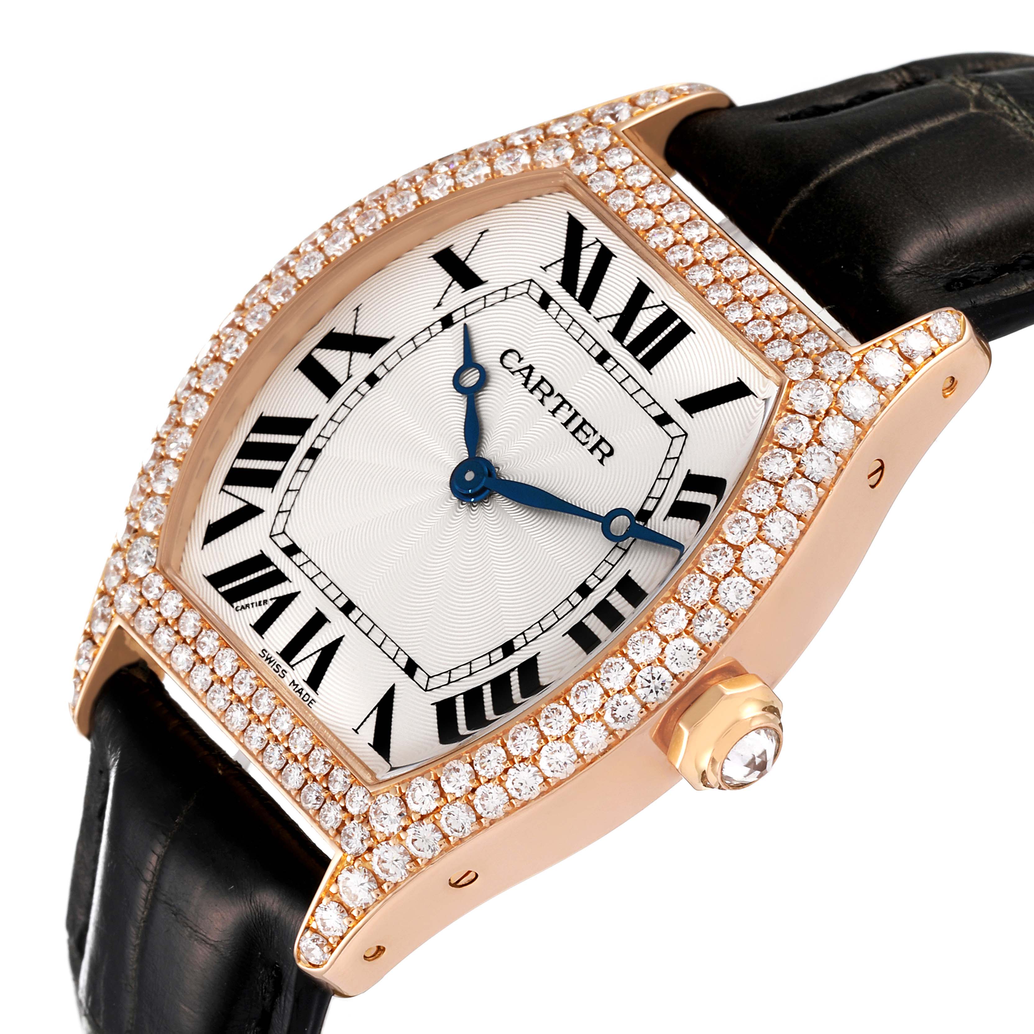 The Cartier Tortue WA503751 Women's Rose Gold Silver Dial WA503751 Women's Rose Gold Silver Dial watch is shown at an angled close-up, highlighting its diamond-encrusted bezel and black leather strap.