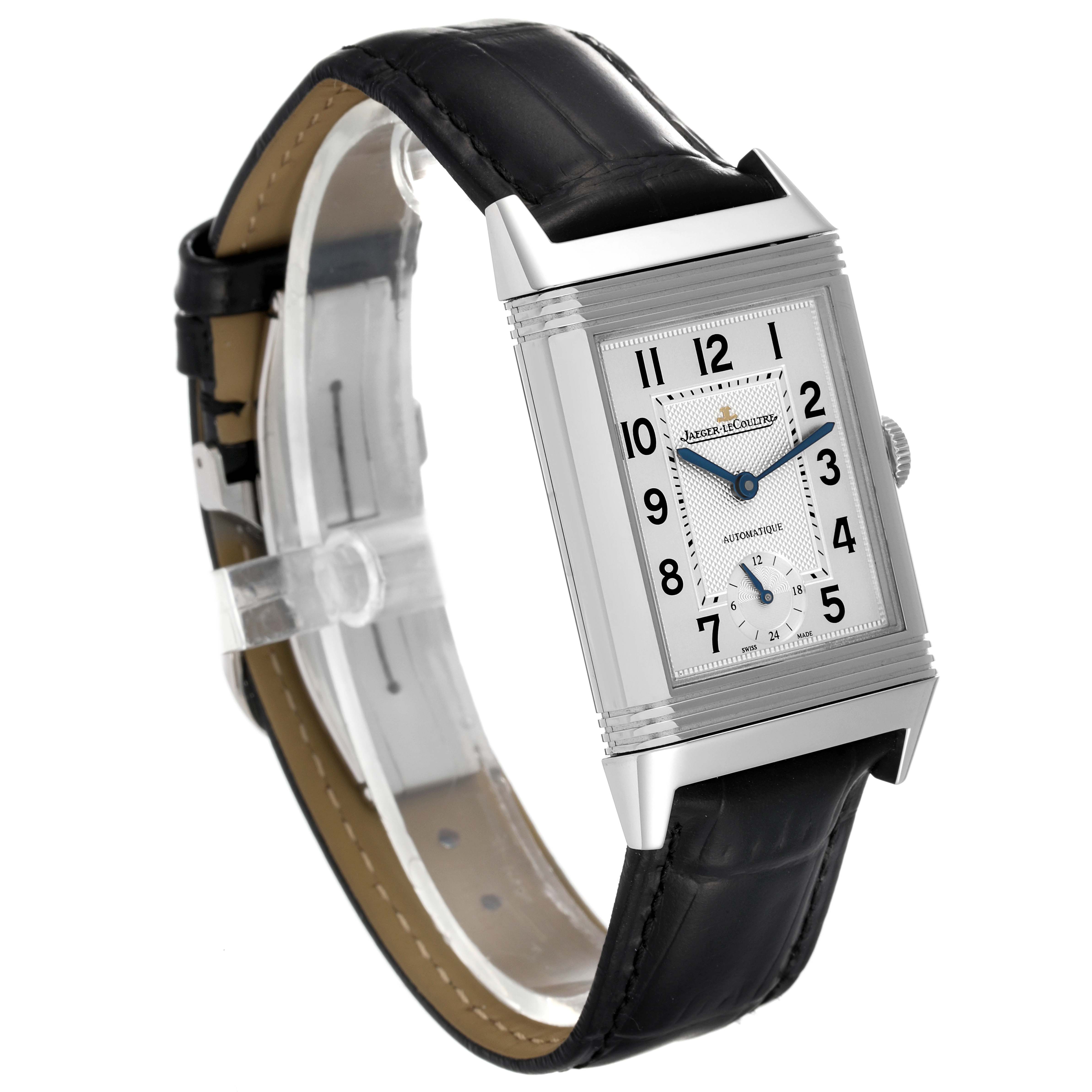 This image shows a Jaeger-LeCoultre Reverso watch at a slight angle, displaying its rectangular dial, black leather strap, and side crown.