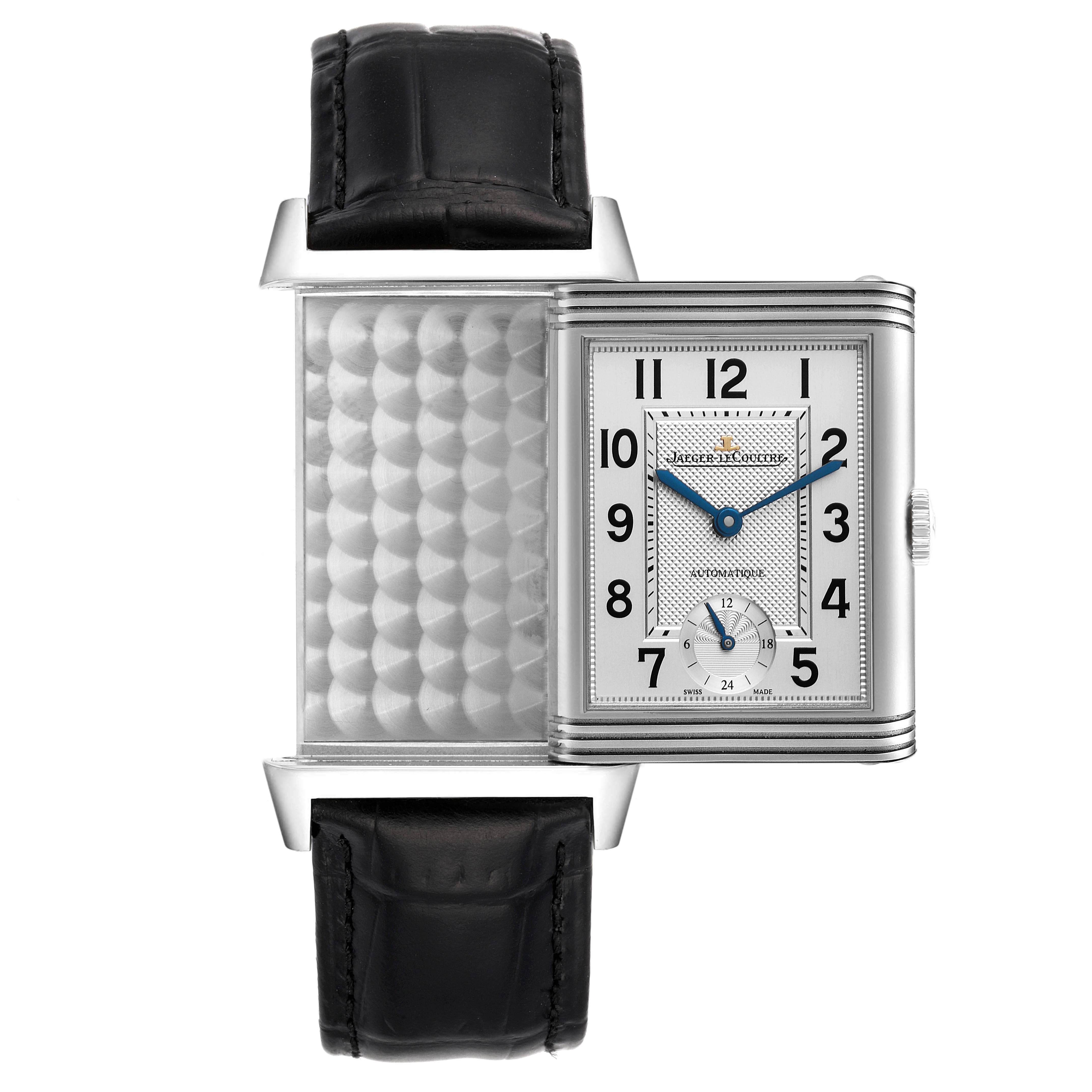 The image shows a top-down view of a Jaeger LeCoultre Reverso Q3808420 Men's Stainless Steel Silver Dial Q3808420 Men's Stainless Steel Silver Dial watch with its case swiveled to reveal the elaborate back panel.