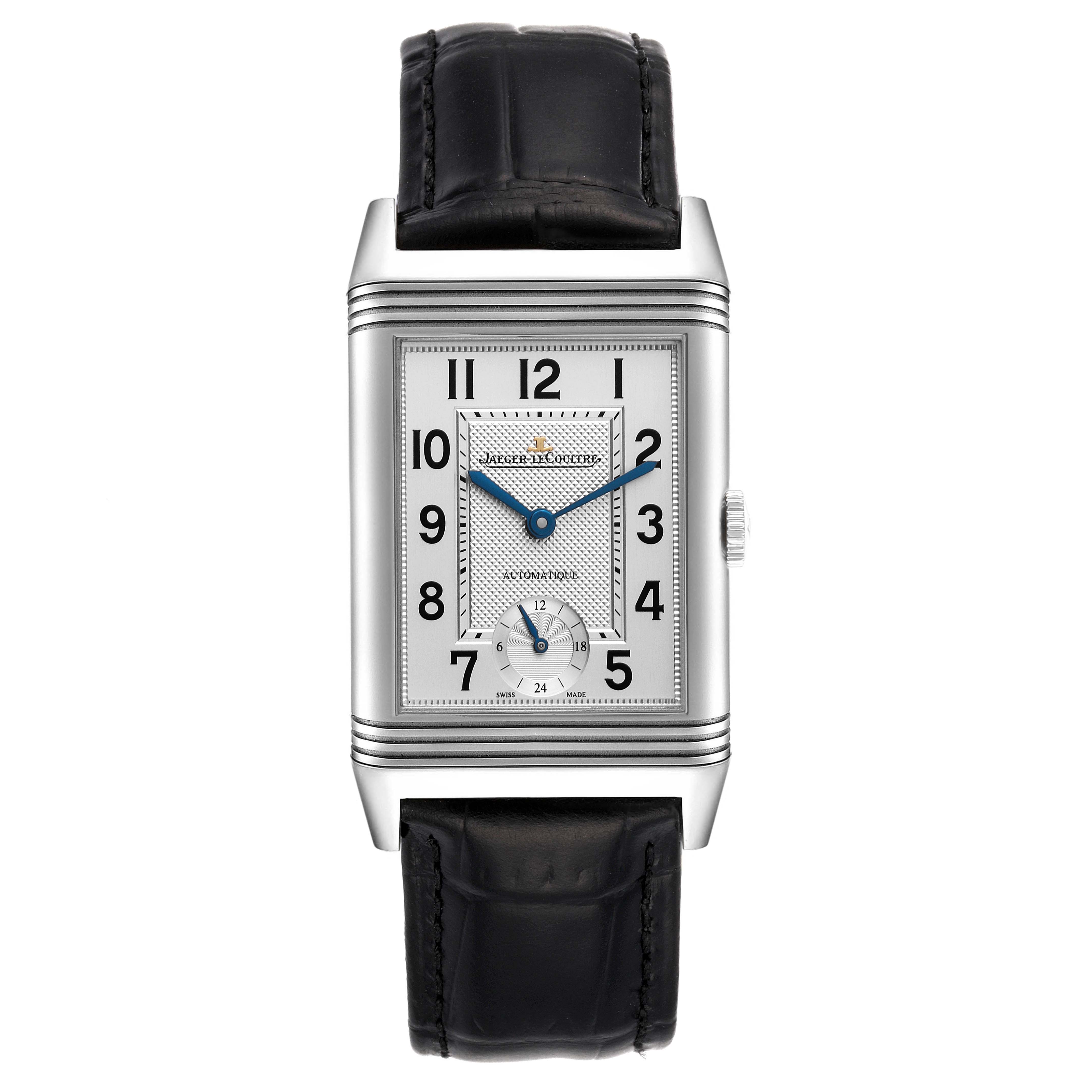 The image shows a front view of the Jaeger-LeCoultre Reverso watch with a visible black leather strap and silver rectangular case.