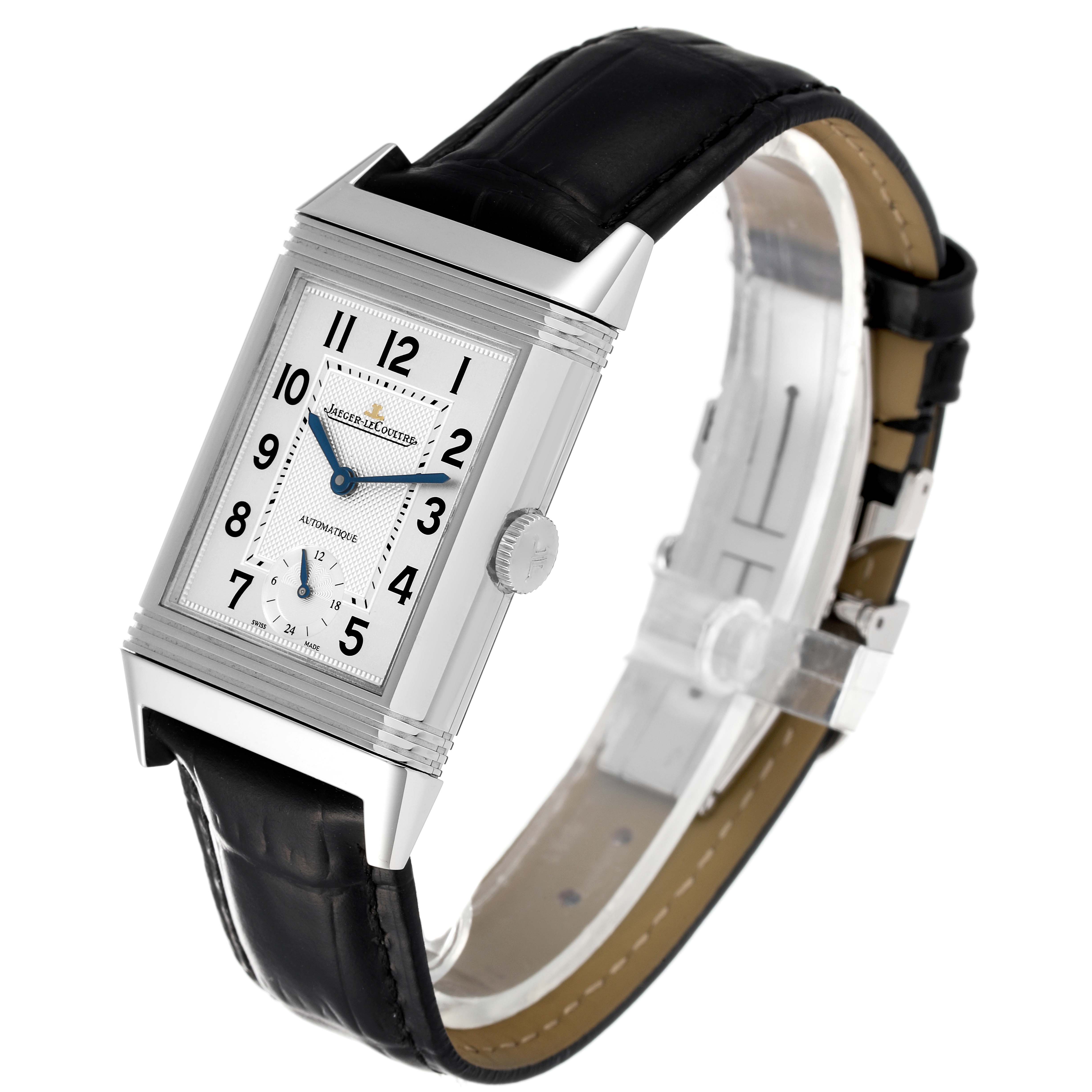 The watch shows a front angle view of the Reverso model by Jaeger LeCoultre, including its rectangular face, dial, crown, and leather strap.