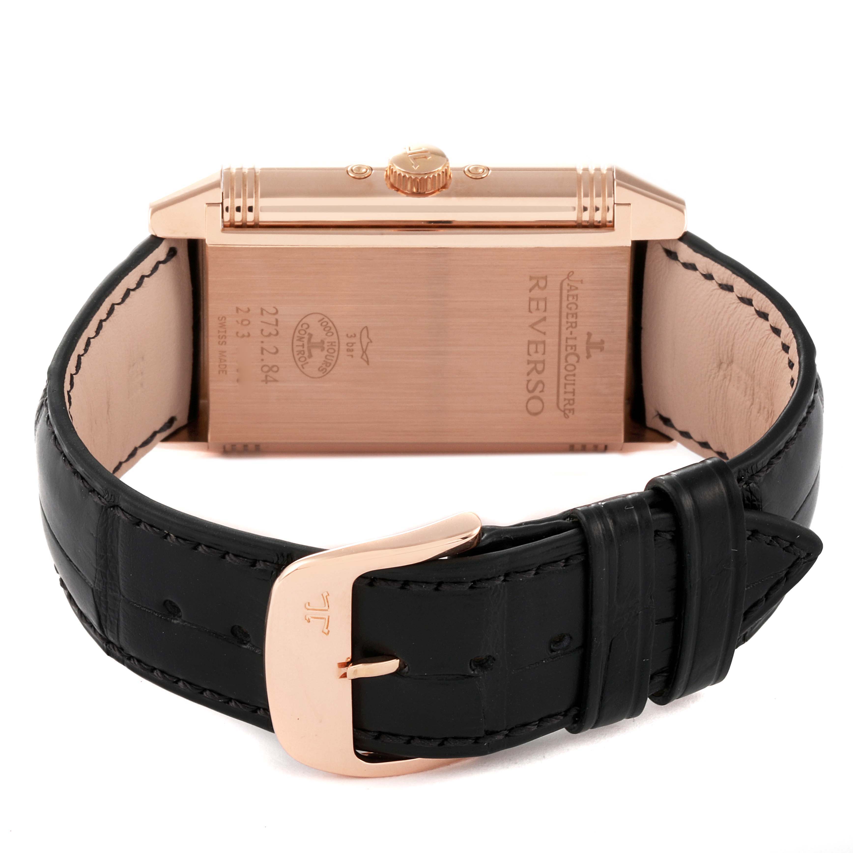 The image shows the back view of a Jaeger LeCoultre Reverso Q3752520 Men's Rose Gold Silver Dial Q3752520 Men's Rose Gold Silver Dial watch, highlighting its case, crown, and black leather strap.