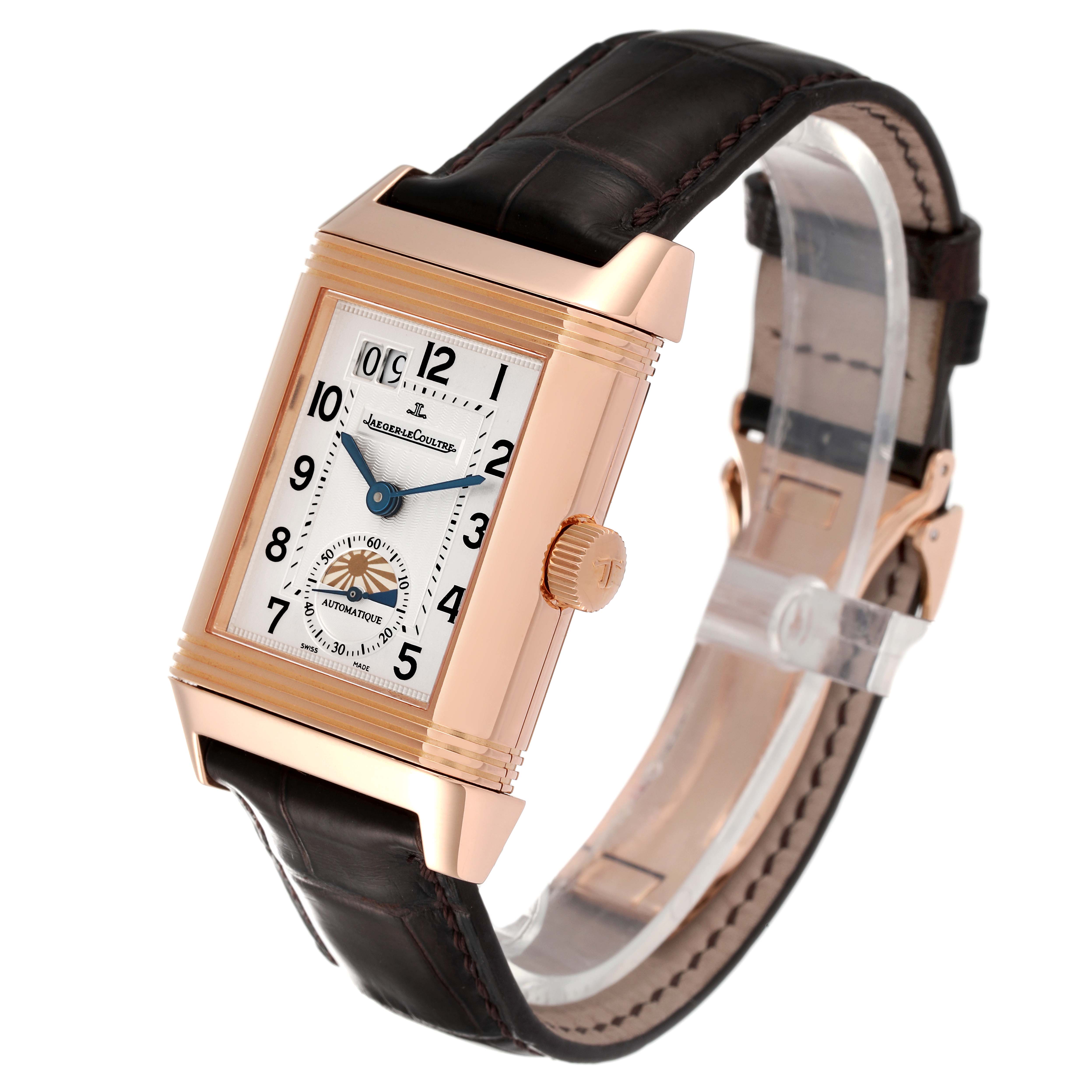 The Jaeger LeCoultre Reverso Q3032420 Men
s Rose Gold Silver Dial Q3032420 Men
s Rose Gold Silver Dial watch is shown at an oblique angle, displaying its face, strap, and crown.