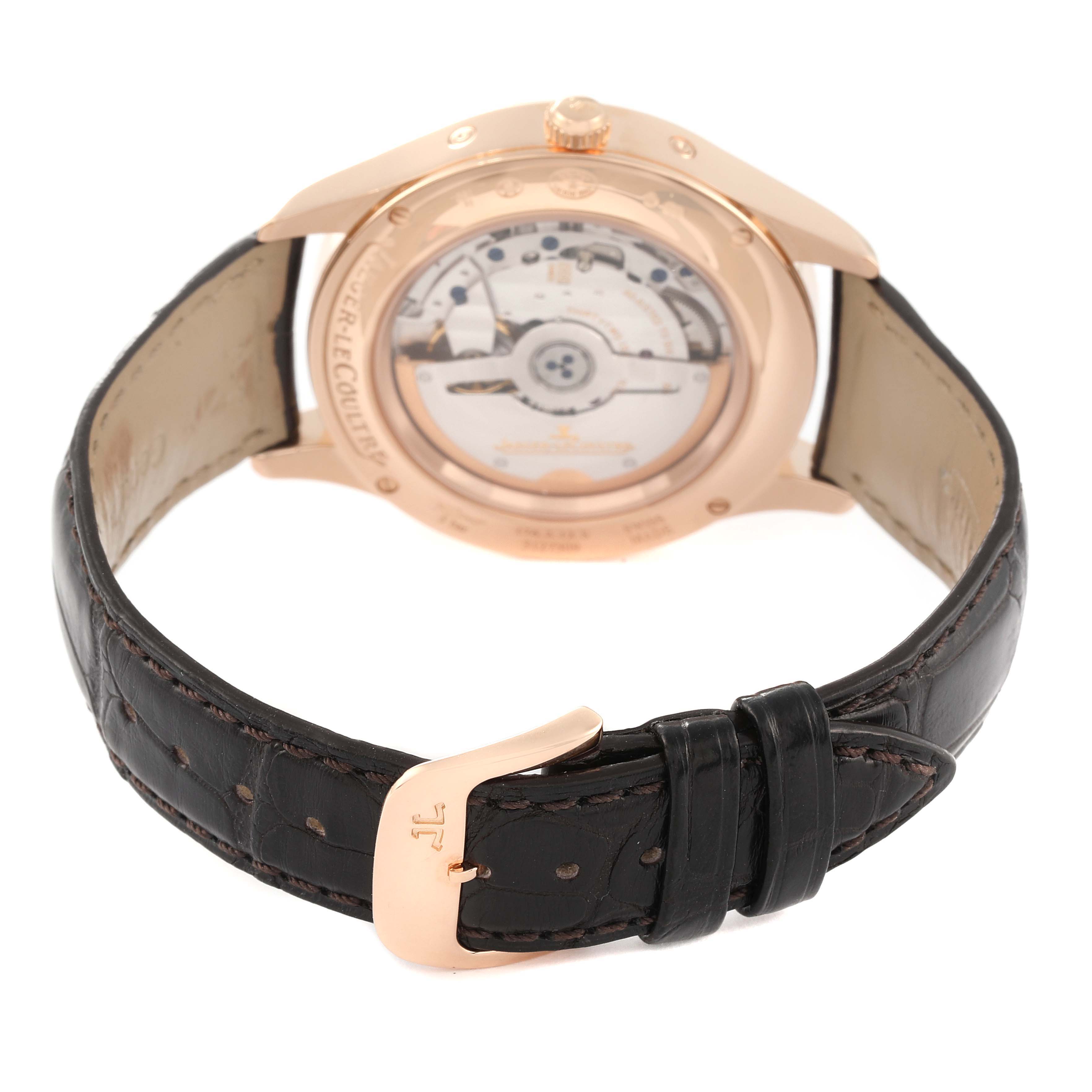 The image shows the back view of a Jaeger-LeCoultre Master model watch, highlighting its movement and black leather strap.