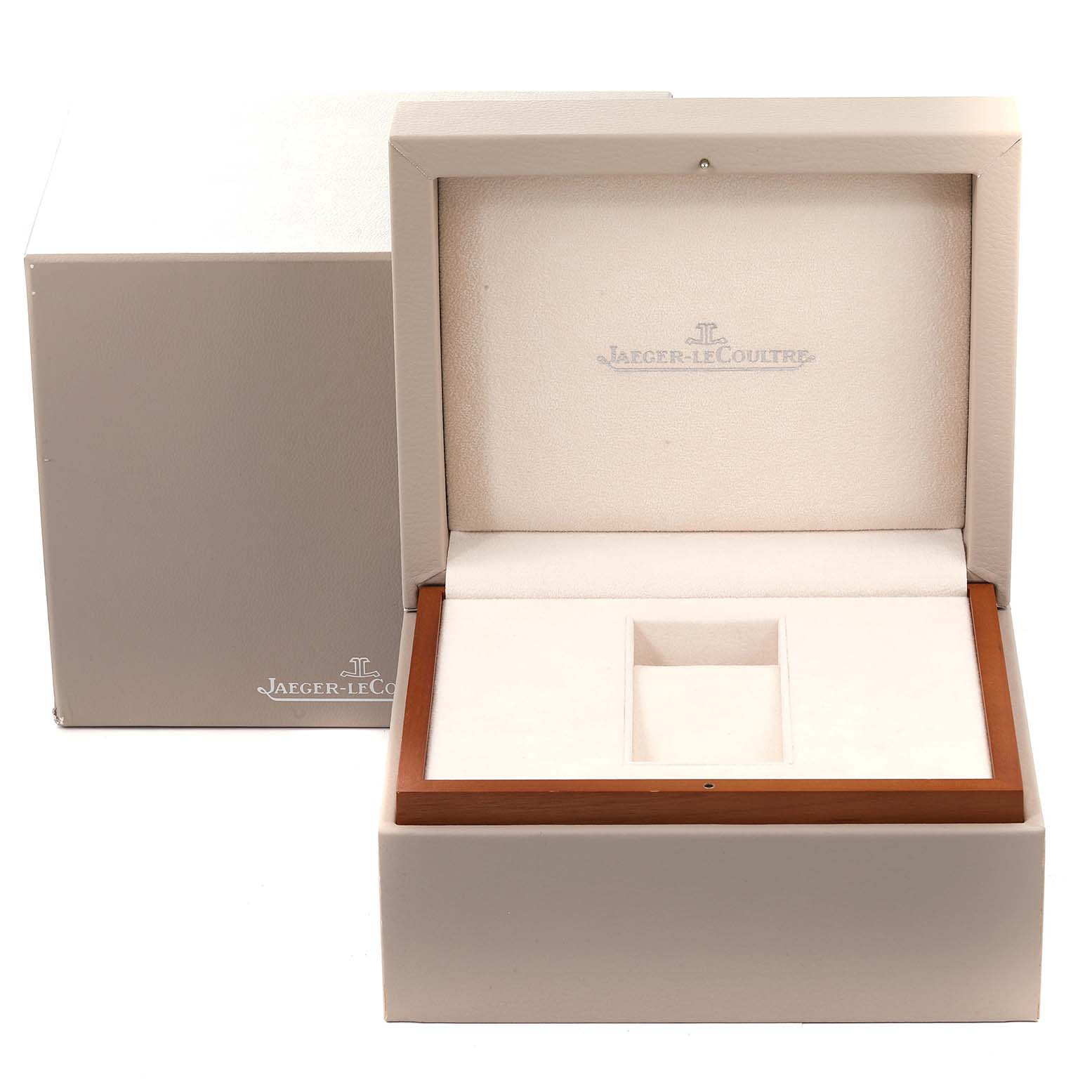 This image shows an open Jaeger-LeCoultre Reverso watch box, displaying the inner compartments and the brand
s logo.