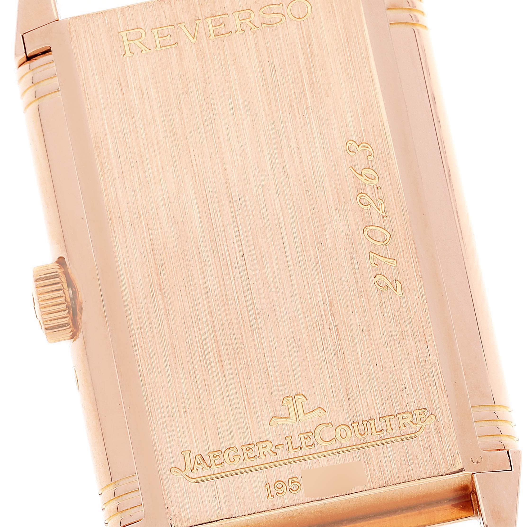 This image shows the back case of a Jaeger LeCoultre Reverso Q2752420 Men
s Rose Gold Silver Dial Q2752420 Men
s Rose Gold Silver Dial watch, highlighting the engravings and the crown on the side.