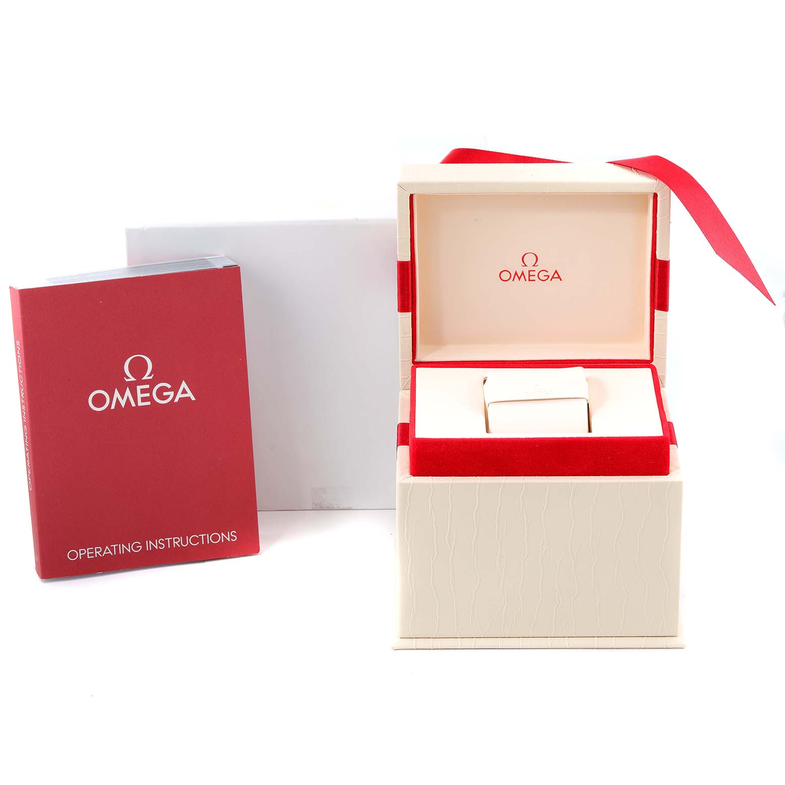 The image shows the box, cushion, and operating instructions for the Omega 123.25.24.60.05.002 Women's Steel and Gold (two tone) Mother of Pearl Dial 123.25.24.60.05.002 Women's Steel and Gold (two tone) Mother of Pearl Dial Constellation Star Steel Rose Gold Diamond Ladies Watch 123.25.24.60.05.002.