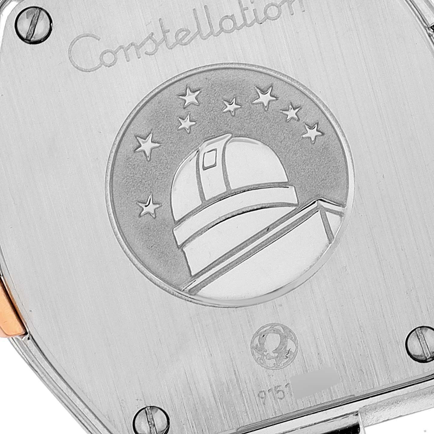 The image shows the back of the Omega 123.20.24.60.02.001 Women's Steel and Gold (two tone) Silver Dial 123.20.24.60.02.001 Women's Steel and Gold (two tone) Silver Dial Constellation Steel Rose Gold Ladies Watch 123.20.24.60.02.001, highlighting its engraved design.
