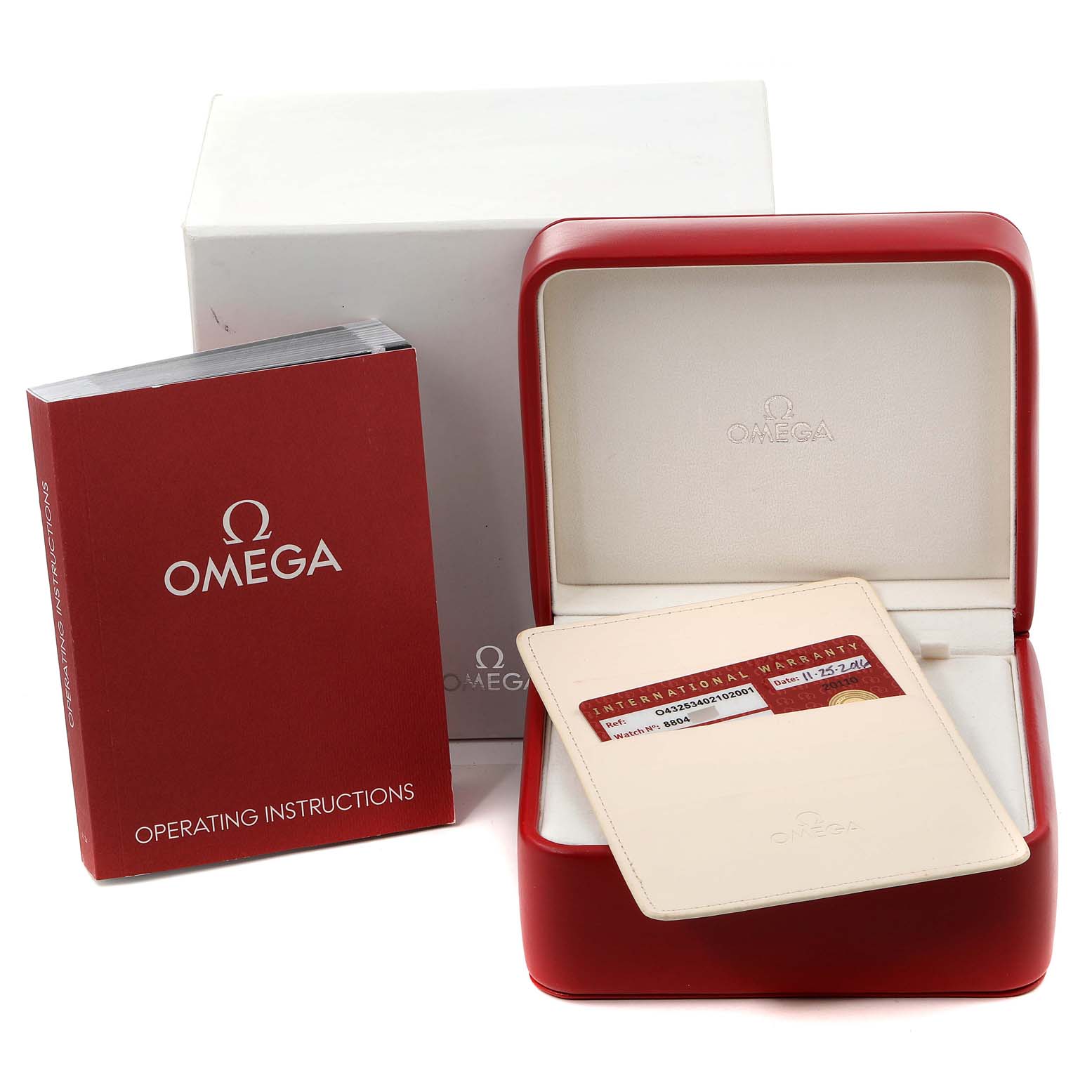 The image shows the packaging, warranty card, and operating instructions for an Omega De Ville 432.53.40.21.02.001 Men's Yellow Gold Silver Dial 432.53.40.21.02.001 Men's Yellow Gold Silver Dial watch.