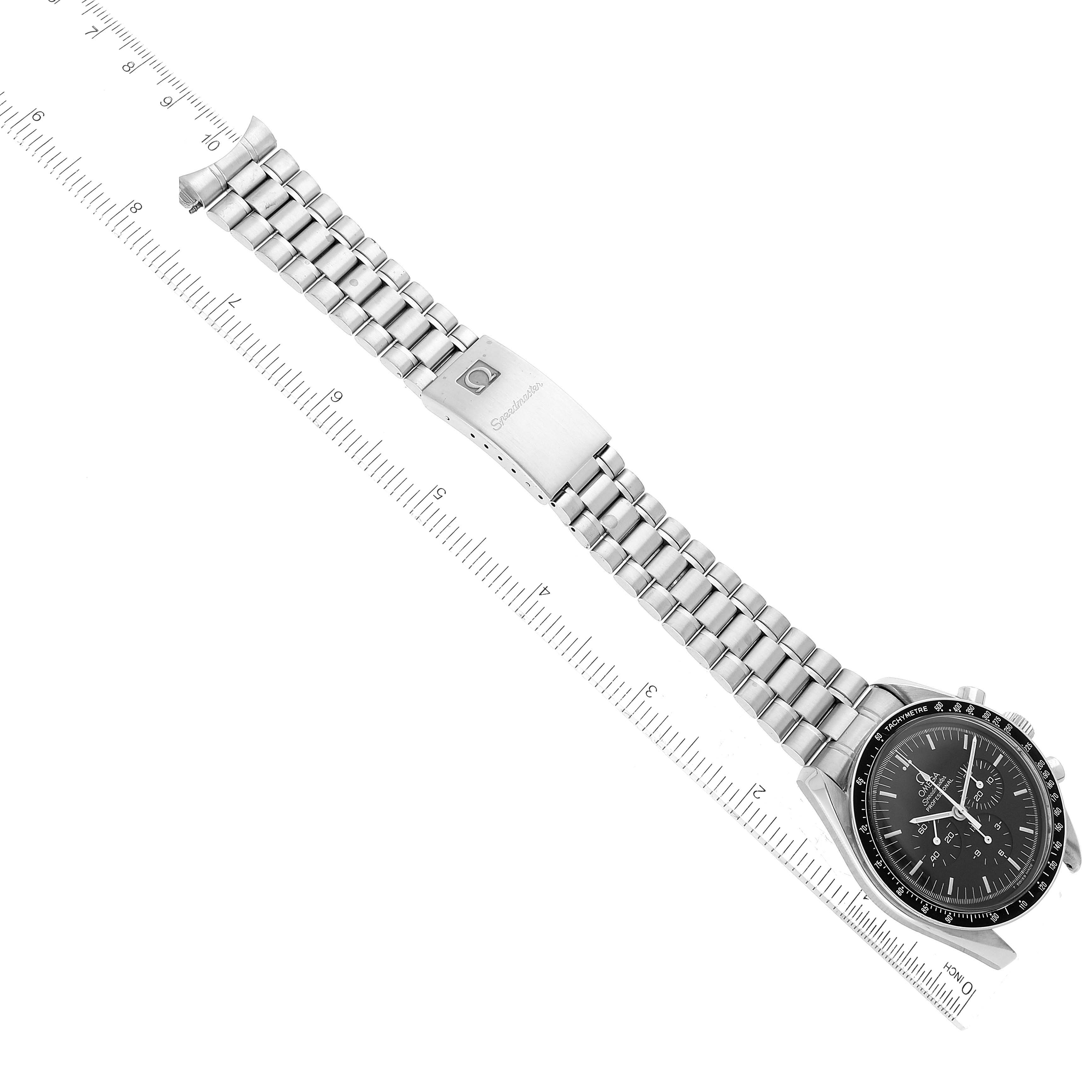 The Omega Speedmaster 3590.50.00 Men
s Stainless Steel Black Dial 3590.50.00 Men
s Stainless Steel Black Dial watch is shown flat, with the dial, stainless steel bracelet, and clasp visible against a ruler for scale.