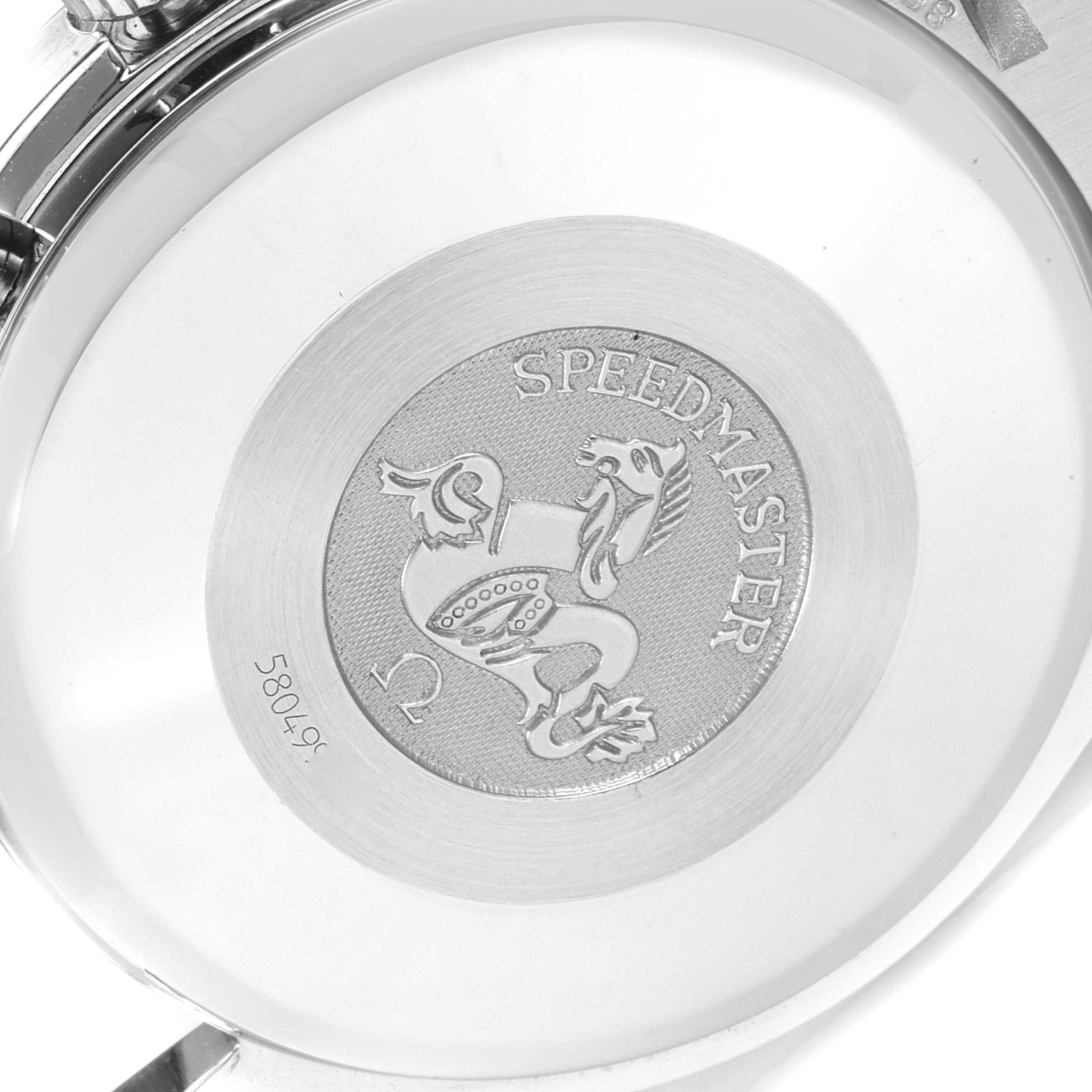 The image shows the back case of the Omega Speedmaster 3513.82.00 Men's Stainless Steel Blue Dial 3513.82.00 Men's Stainless Steel Blue Dial watch, featuring the engraved logo and serial number.