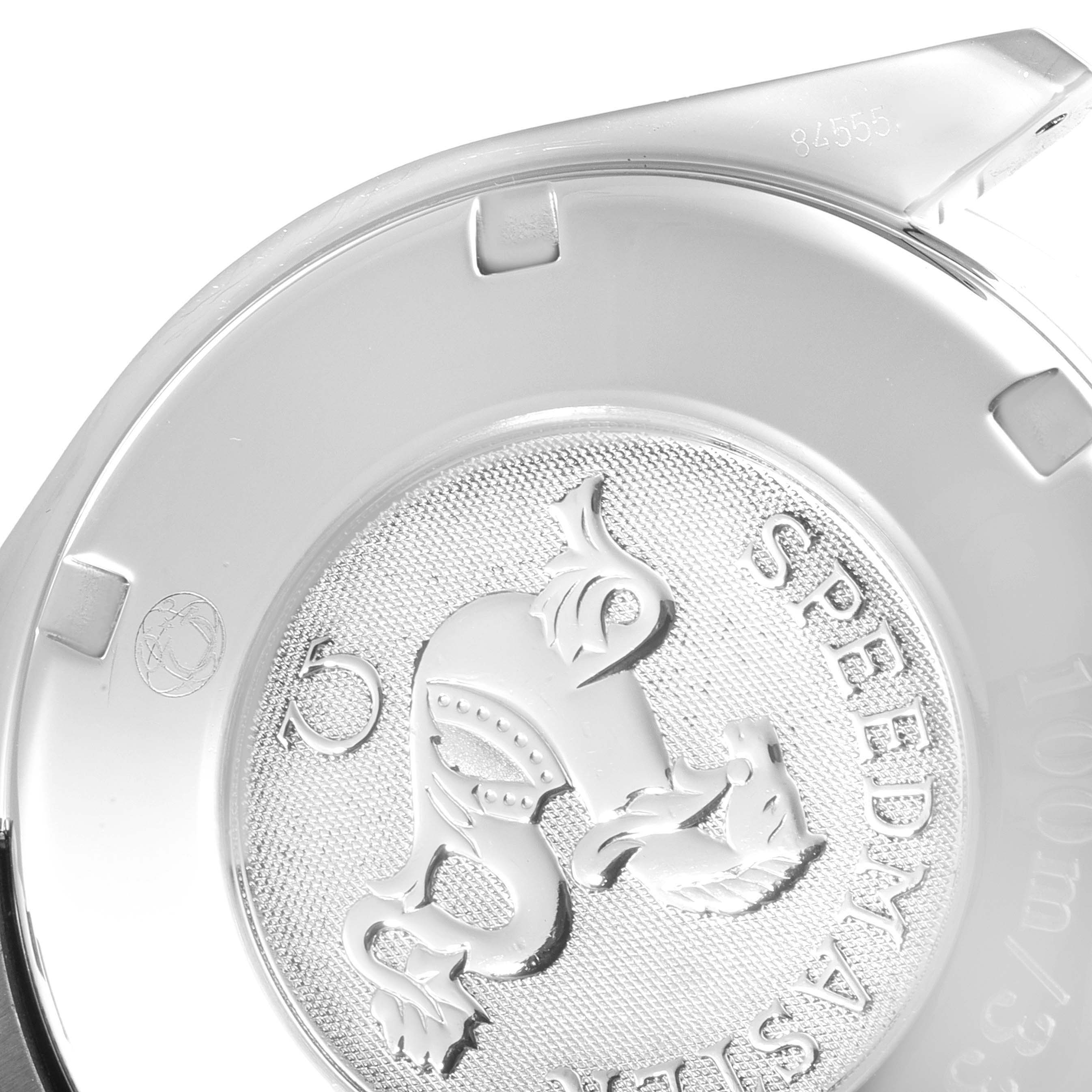 This image shows a close-up of the Omega Speedmaster 3222.80.00 Men
s Stainless Steel Blue Dial 3222.80.00 Men
s Stainless Steel Blue Dial
s case back, highlighting the engraved emblem and part of the model
s name.