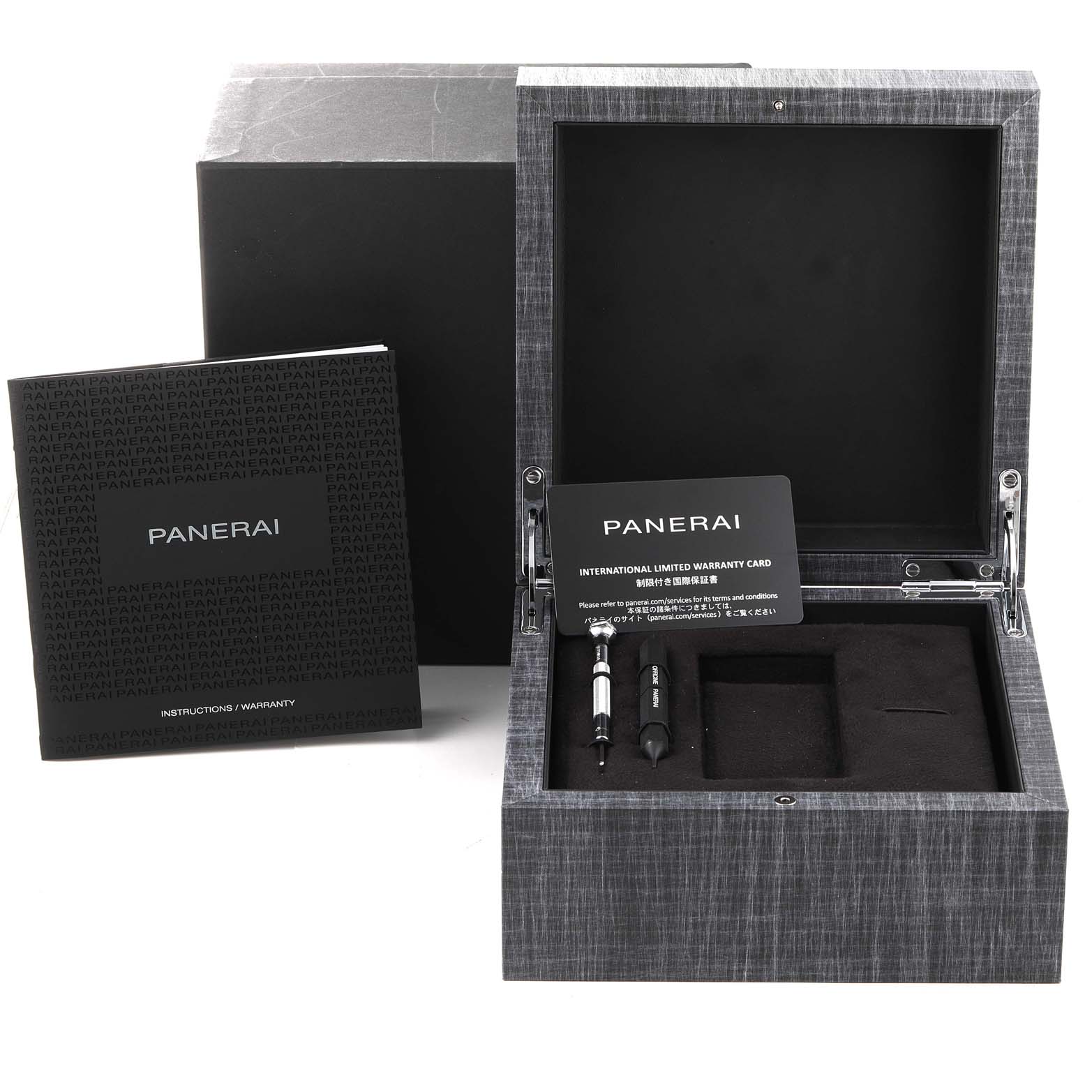 This image shows the open box for the Panerai Luminor PAM01096 Men's Titanium Black Dial PAM01096 Men's Titanium Black Dial model, displaying the warranty card, manual, and tools at a top-down angle.