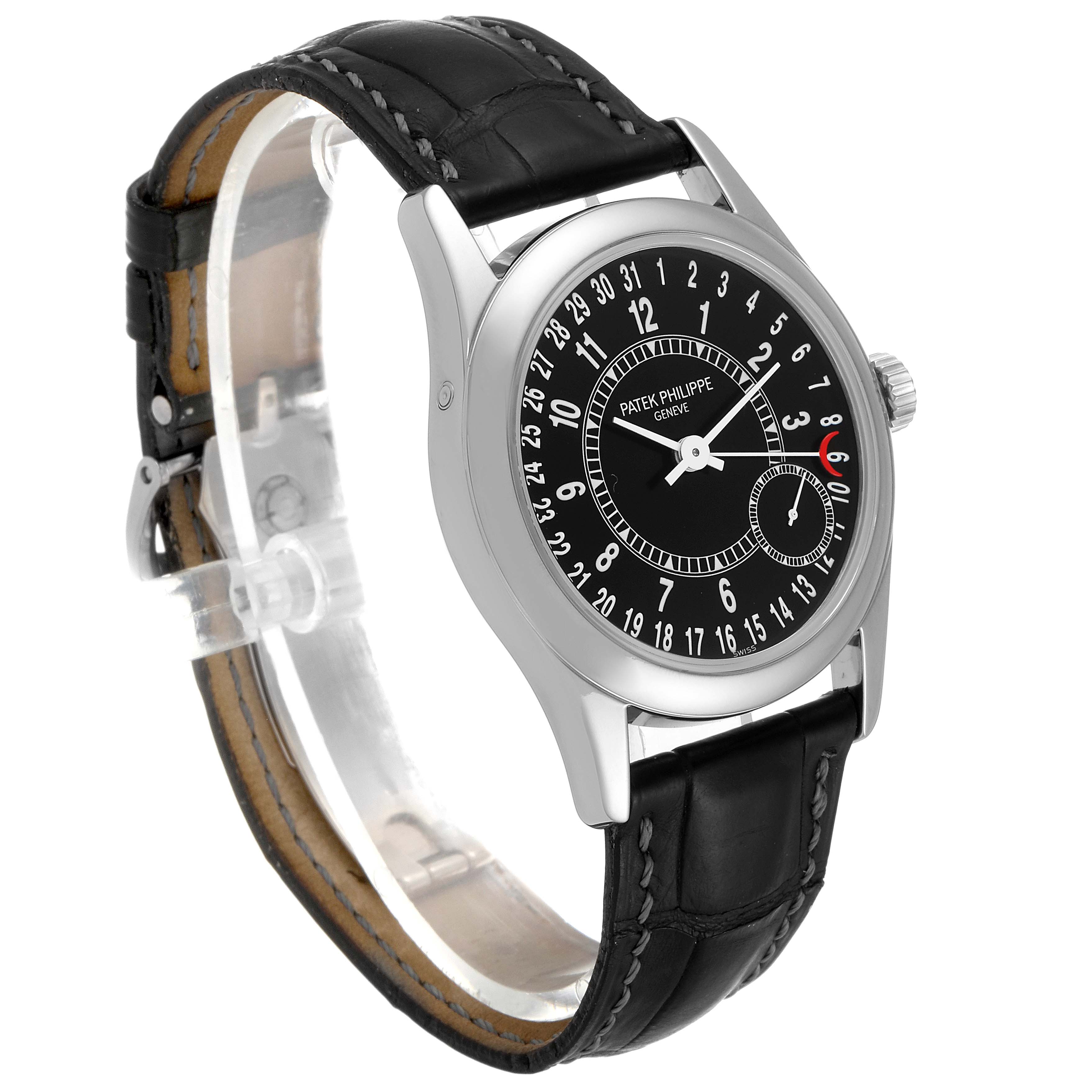 The Patek Philippe Calatrava 6000G Men's White Gold Black Dial 6000G Men's White Gold Black Dial watch is shown at a three-quarter angle, featuring its black dial and leather strap.