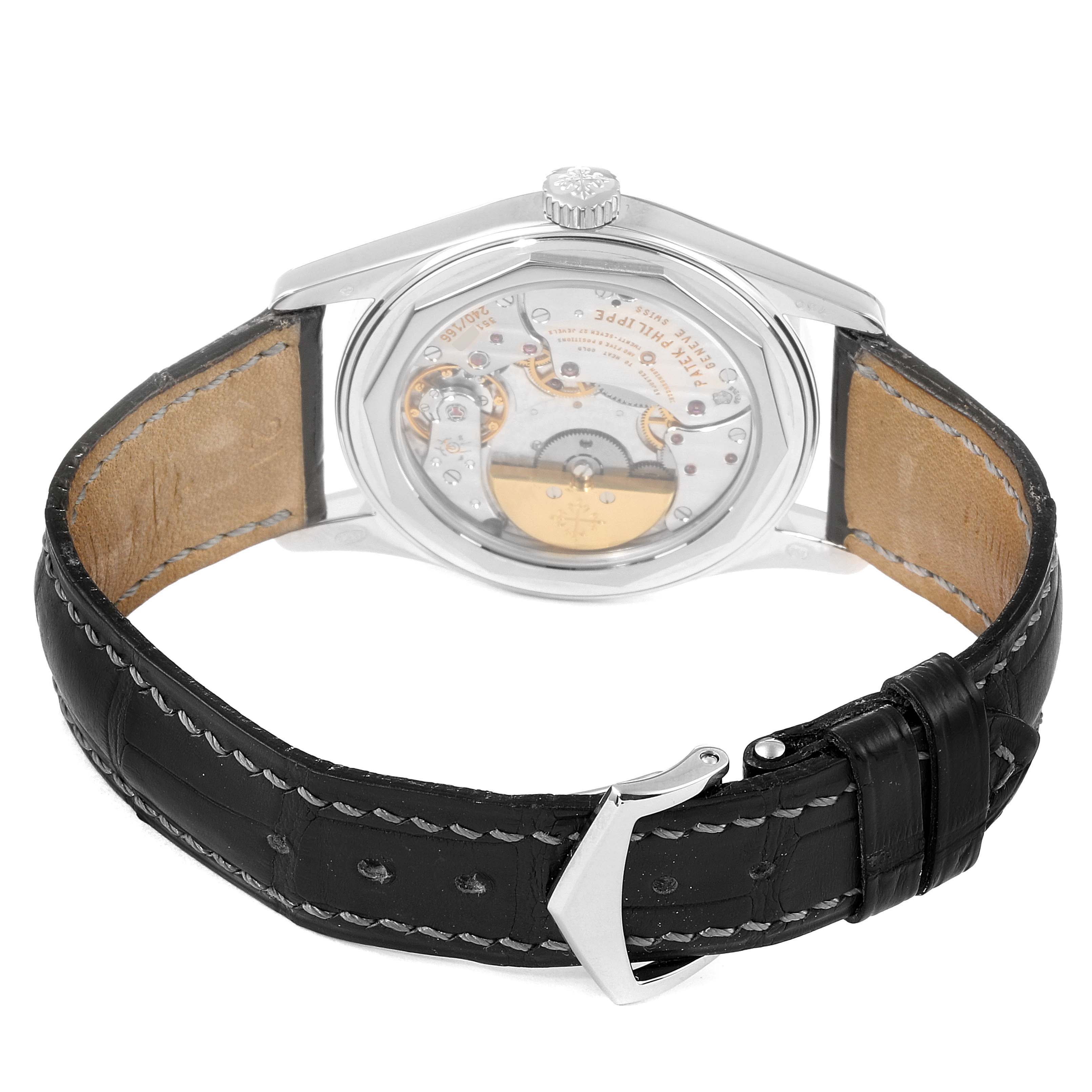 The image shows the back view of a Patek Philippe Calatrava 6000G Men's White Gold Black Dial 6000G Men's White Gold Black Dial watch, highlighting its transparent case back and black leather strap.