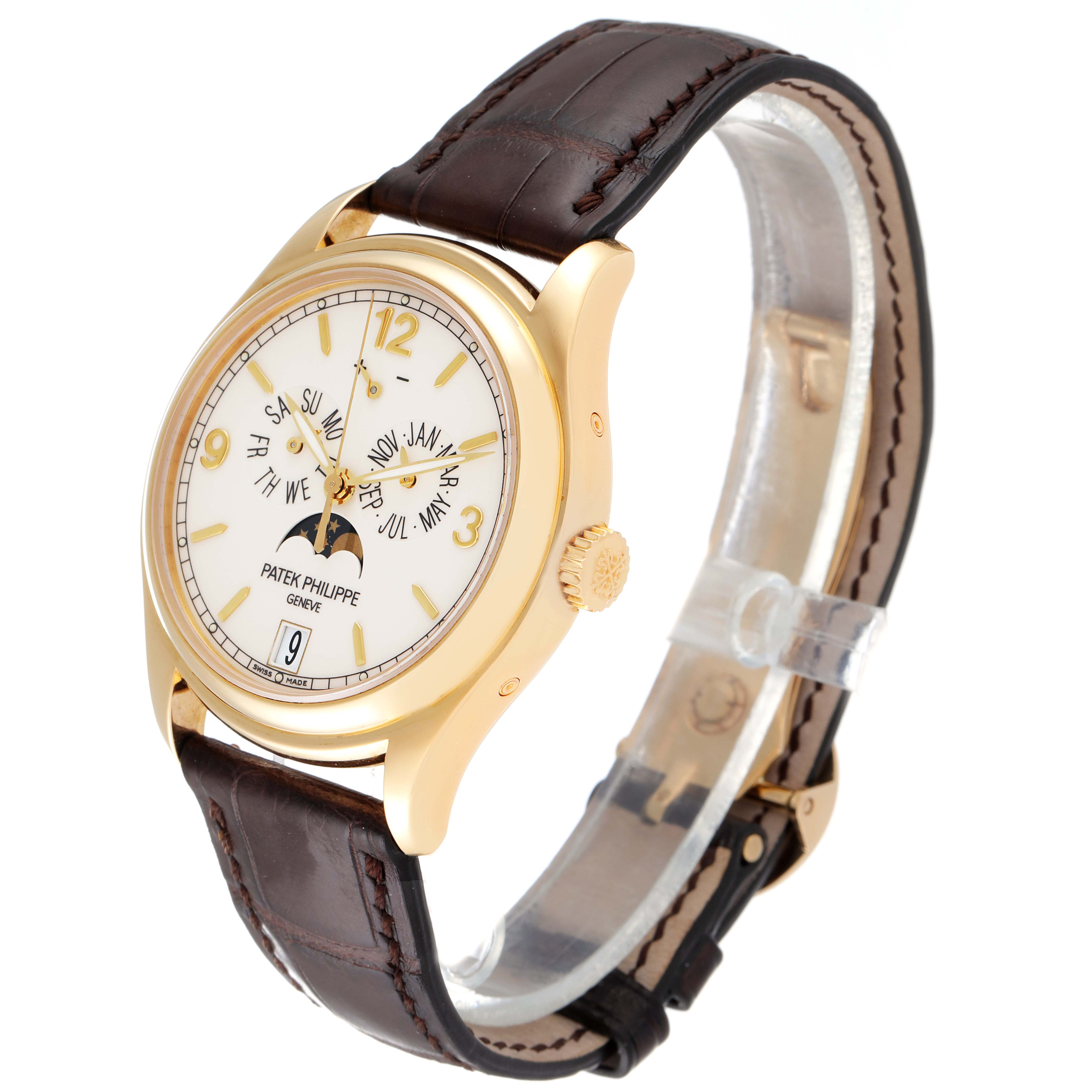 The image shows a Patek Philippe Complications 5146J Men's Yellow Gold Beige Dial 5146J Men's Yellow Gold Beige Dial watch at a three-quarter angle, highlighting the dial, crown, and leather strap.