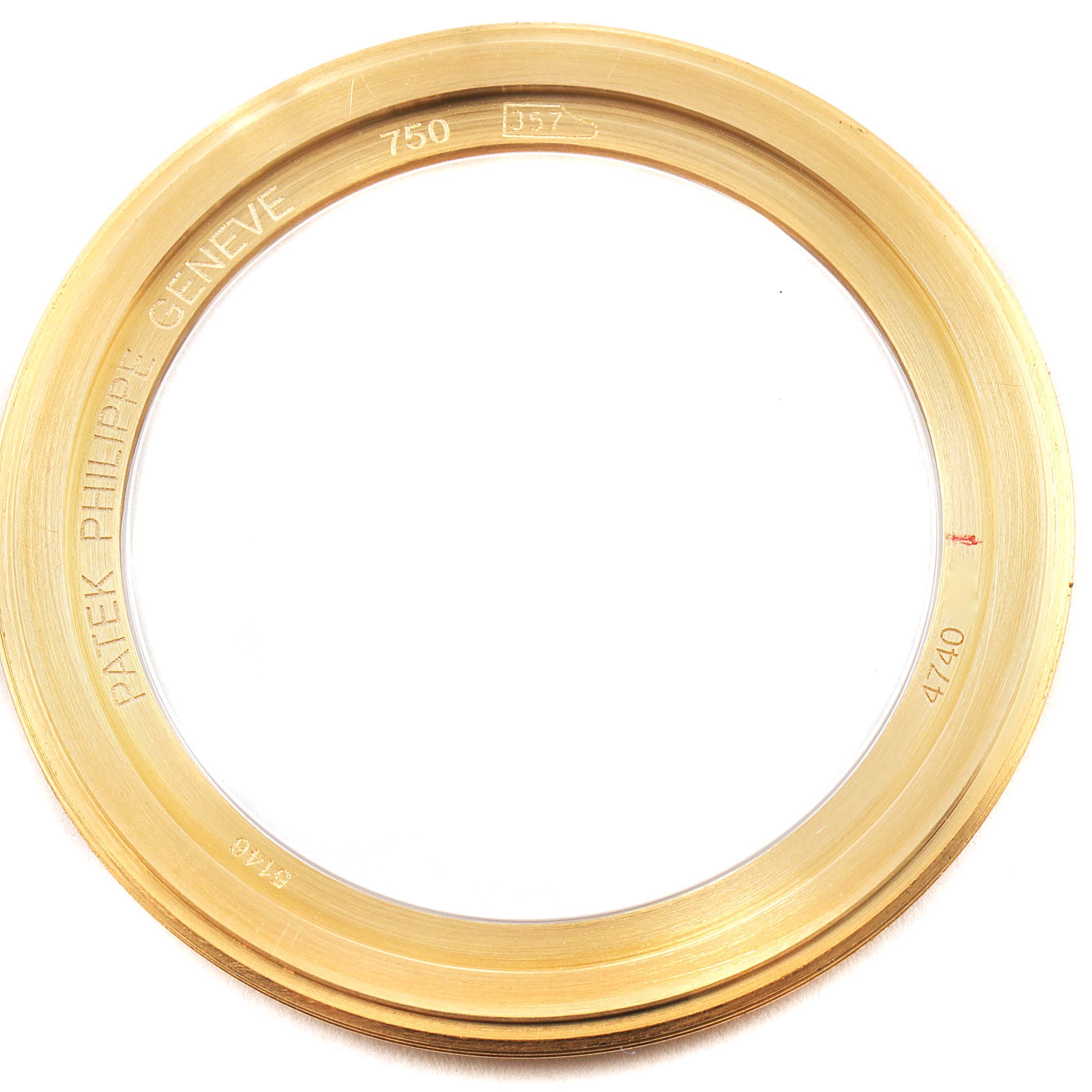 This image shows the gold bezel of a Patek Philippe Complications 5146J Men's Yellow Gold Beige Dial 5146J Men's Yellow Gold Beige Dial model watch, viewed from above.