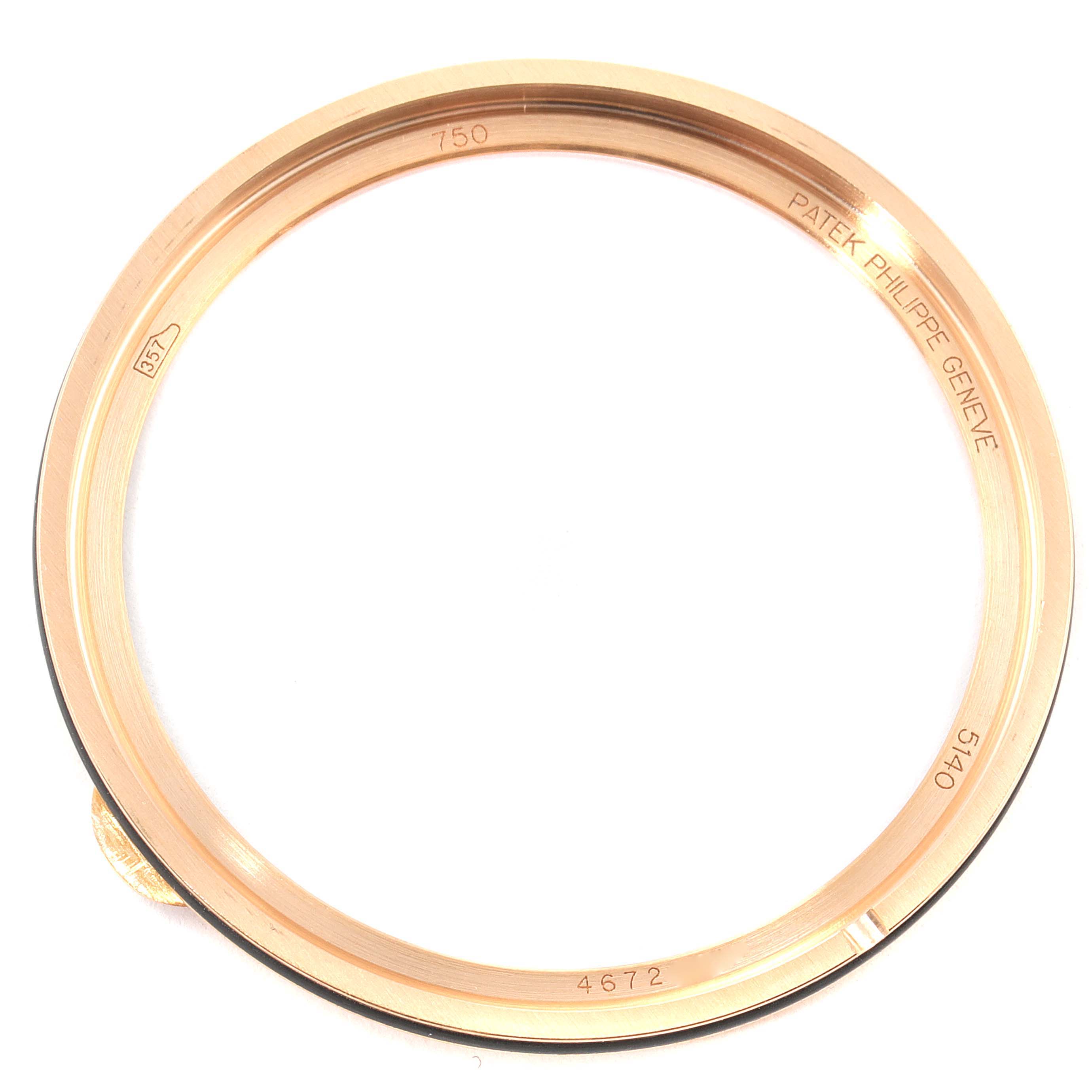 The image shows a top-down view of the bezel of a Patek Philippe Complications 5140R-001 Men's Rose Gold Brown Dial 5140R-001 Men's Rose Gold Brown Dial model watch.