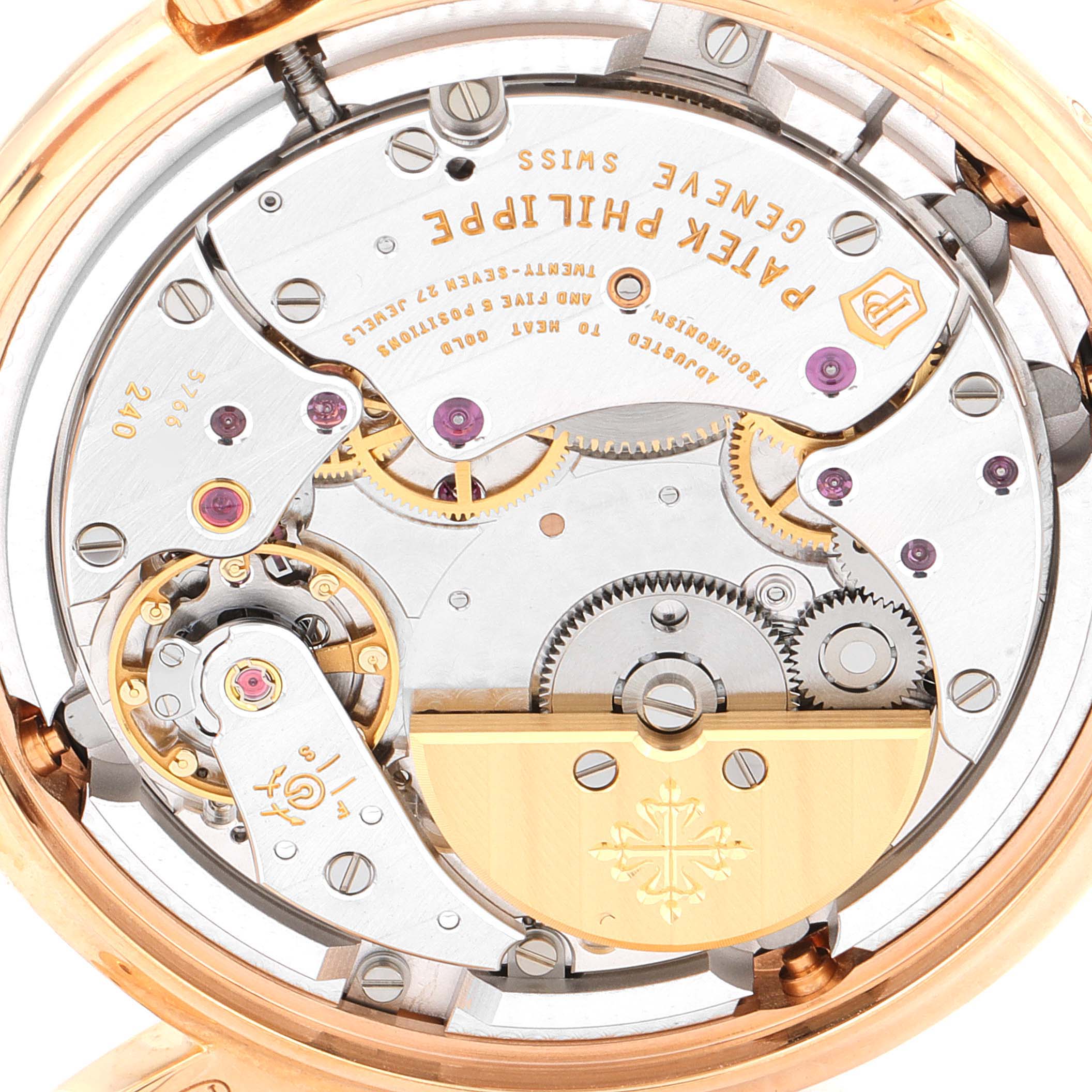 The image shows the intricate back view of the Patek Philippe Complications 5140R-001 Men's Rose Gold Brown Dial 5140R-001 Men's Rose Gold Brown Dial model watch, highlighting its mechanical movement.