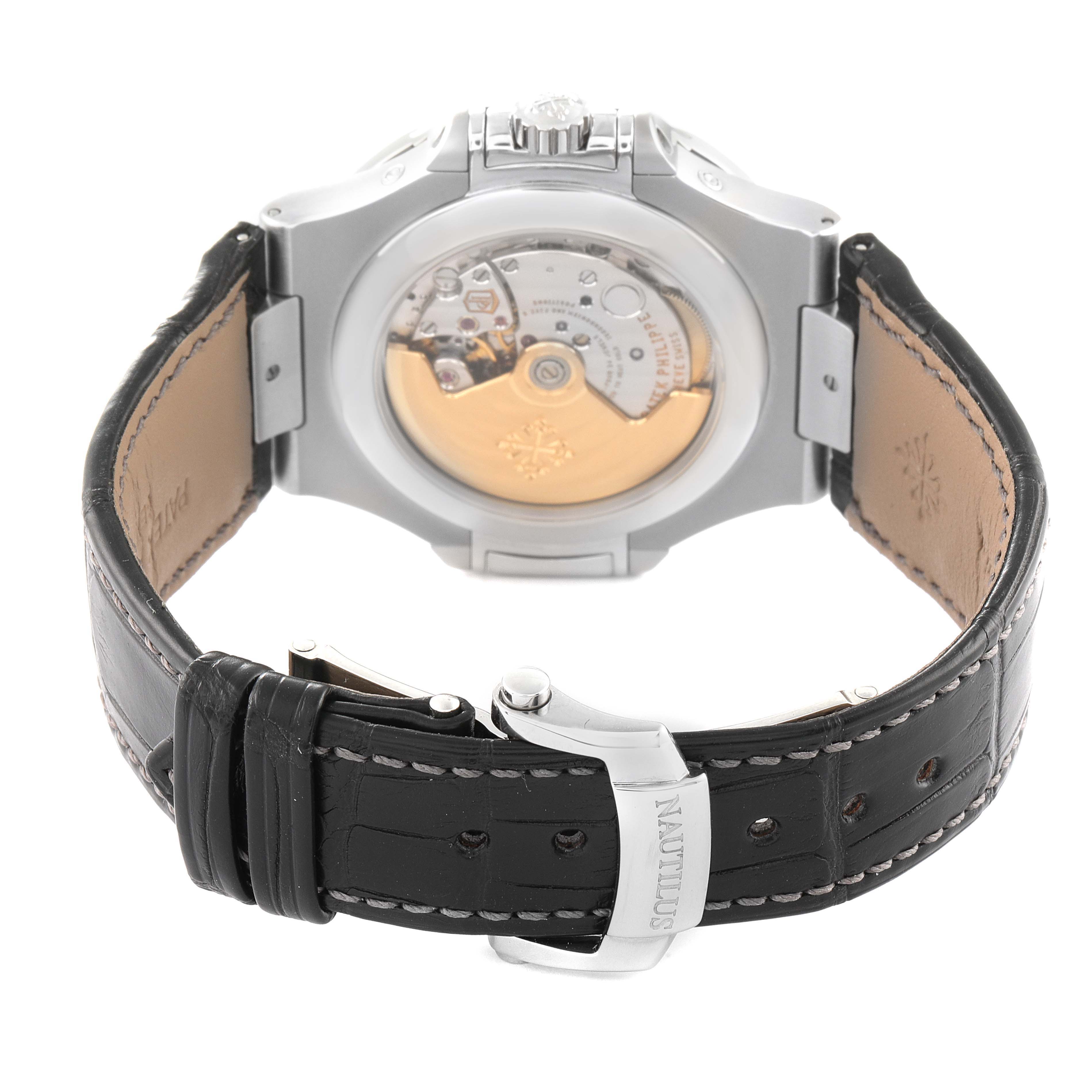 The image shows the back view of the Patek Philippe Nautilus 5726A-001 Men's Stainless Steel Black Dial 5726A-001 Men's Stainless Steel Black Dial watch, highlighting its movement and black leather strap.