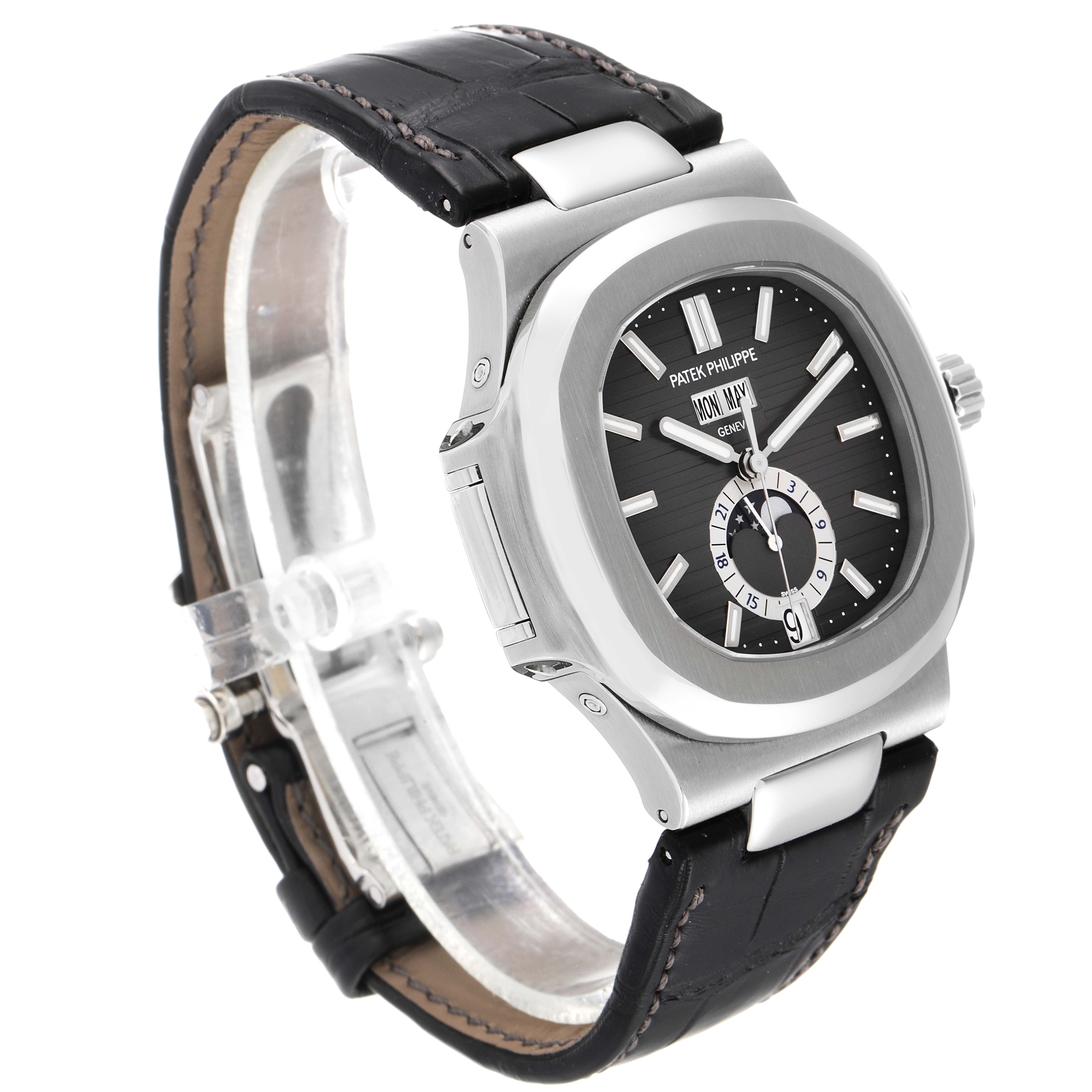 The image shows a Patek Philippe Nautilus 5726A-001 Men's Stainless Steel Black Dial 5726A-001 Men's Stainless Steel Black Dial watch at a three-quarter angle, highlighting its dial, bezel, crown, and leather strap.