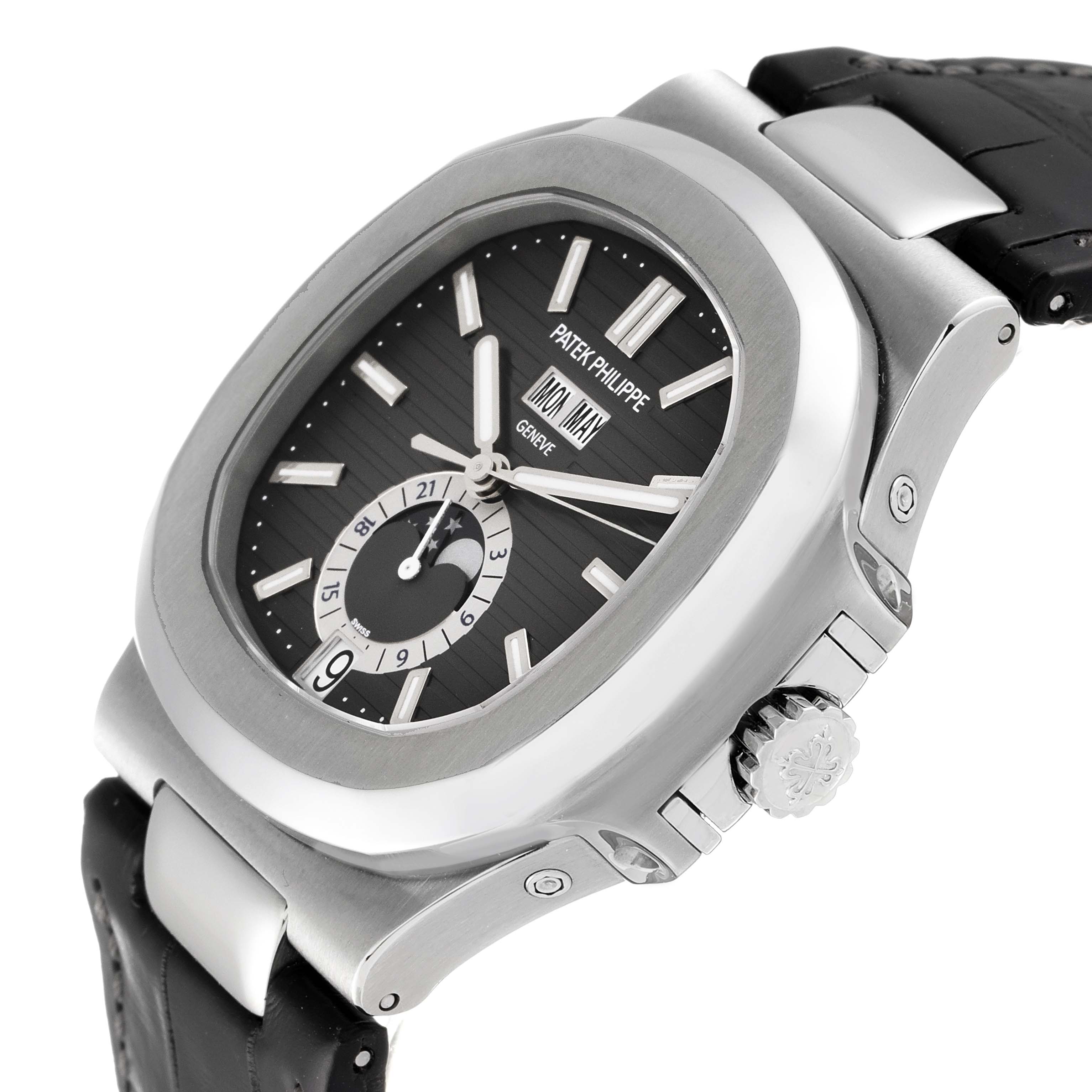 This image shows a Patek Philippe Nautilus 5726A-001 Men's Stainless Steel Black Dial 5726A-001 Men's Stainless Steel Black Dial watch, highlighting its dial, crown, bezel, and leather strap at a slight angle.