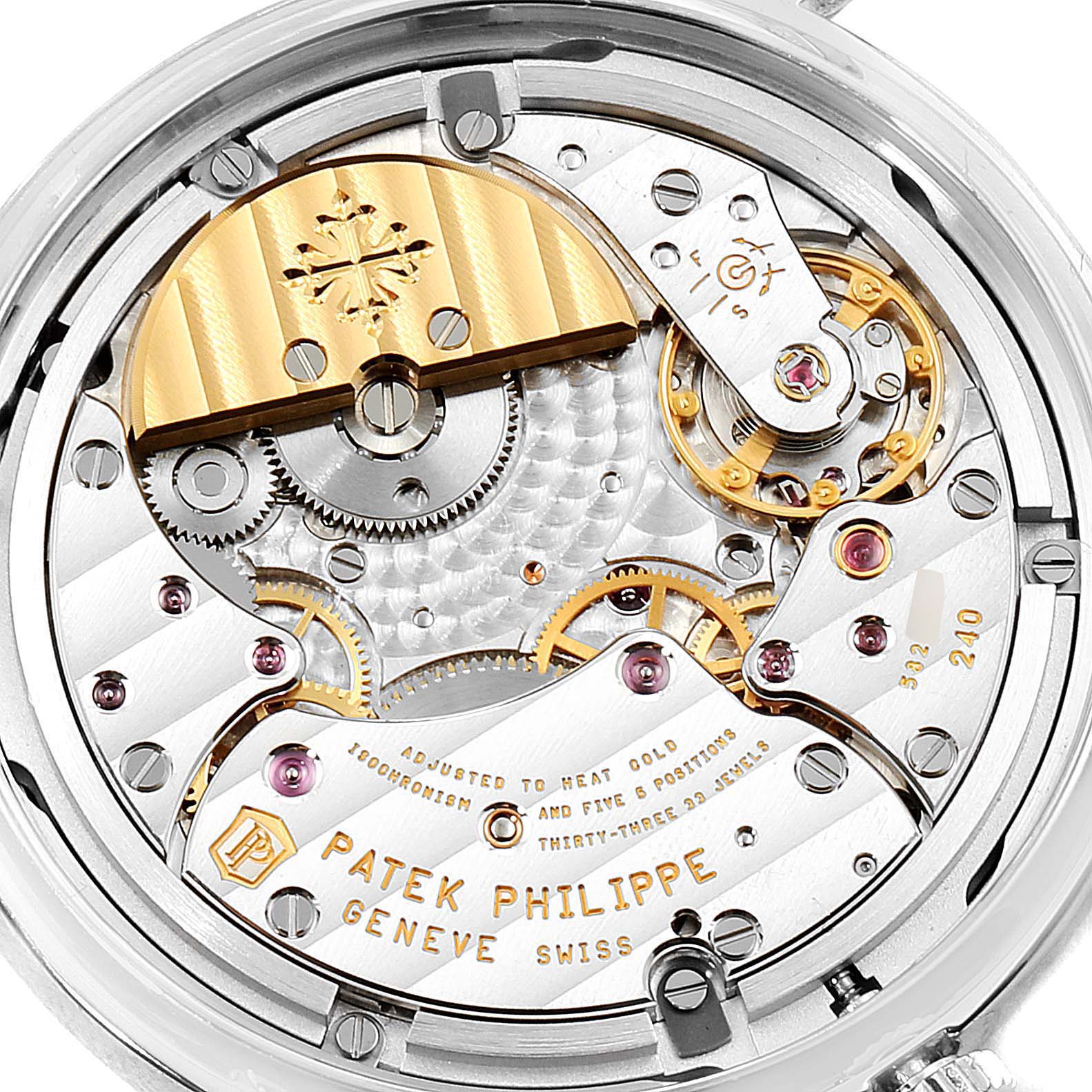 This image shows the intricate inner workings and mechanical parts of a Patek Philippe Complications 7130G-001 Men's White Gold Brown Dial 7130G-001 Men's White Gold Brown Dial model watch from a close-up angle.