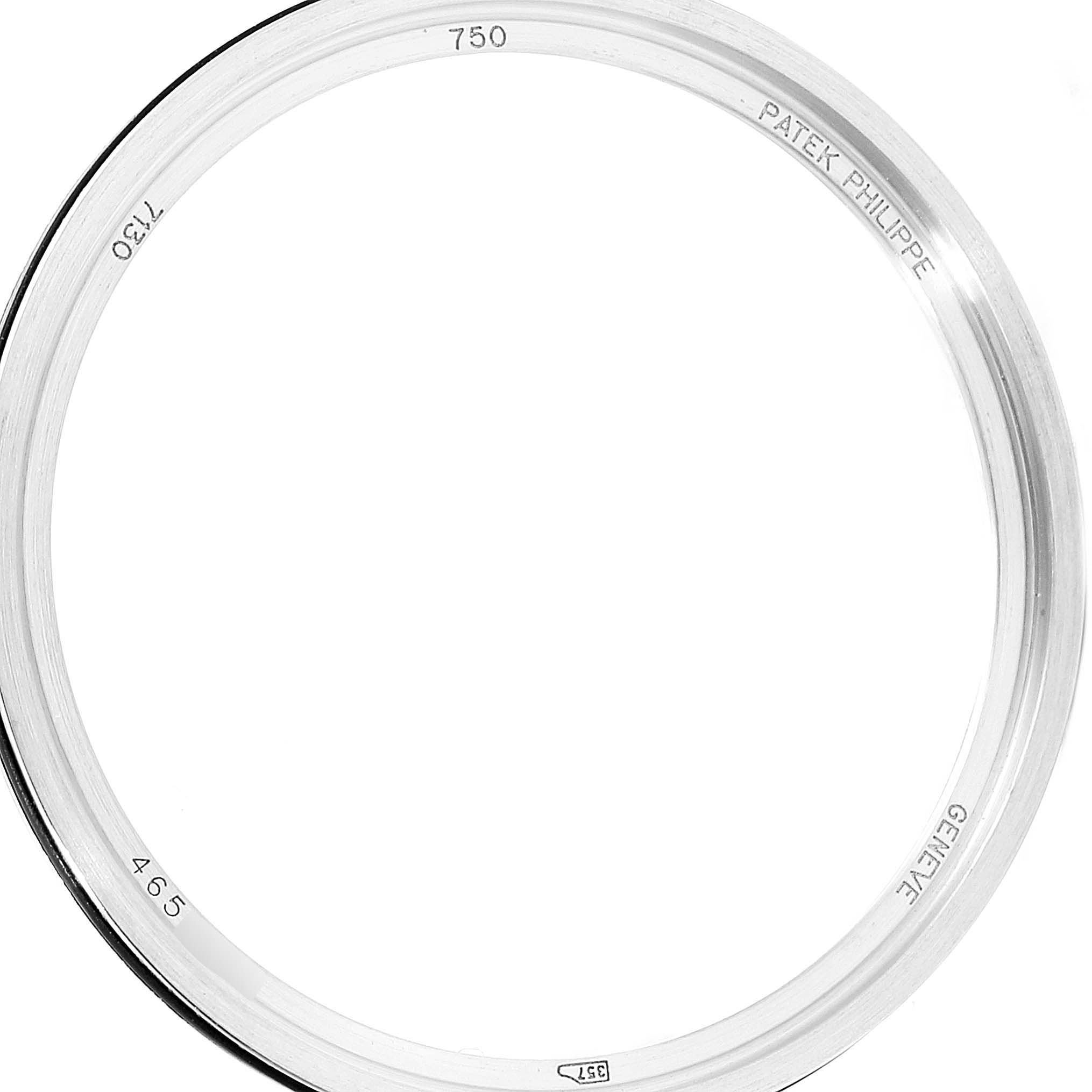 The image shows a close-up of the inner side of a Patek Philippe Complications 7130G-001 Men's White Gold Brown Dial 7130G-001 Men's White Gold Brown Dial watch bezel.