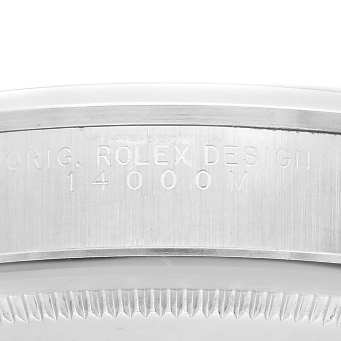 This close-up angle shows the side detail and serial engraving on the bezel of a Rolex Air-King 14000M Men's Stainless Steel Blue Dial 14000M Men's Stainless Steel Blue Dial watch.
