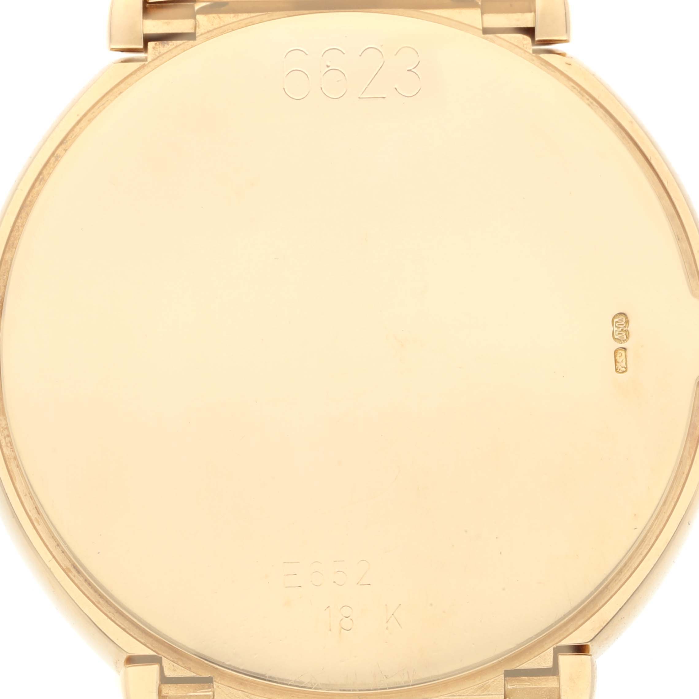 This image shows the back casing of a Rolex Cellini 6623 Men
s Yellow Gold Champagne Dial 6623 Men
s Yellow Gold Champagne Dial model watch, displaying the engraved model number and gold quality mark.