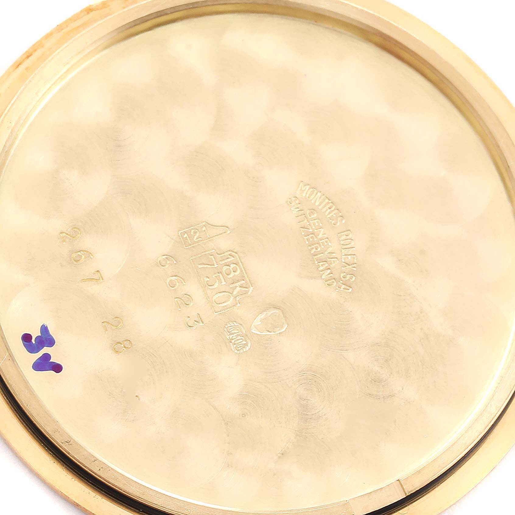 The image shows the inside case back of a Rolex Cellini 6623 Men
s Yellow Gold Champagne Dial 6623 Men
s Yellow Gold Champagne Dial watch, displaying markings and hallmarks.