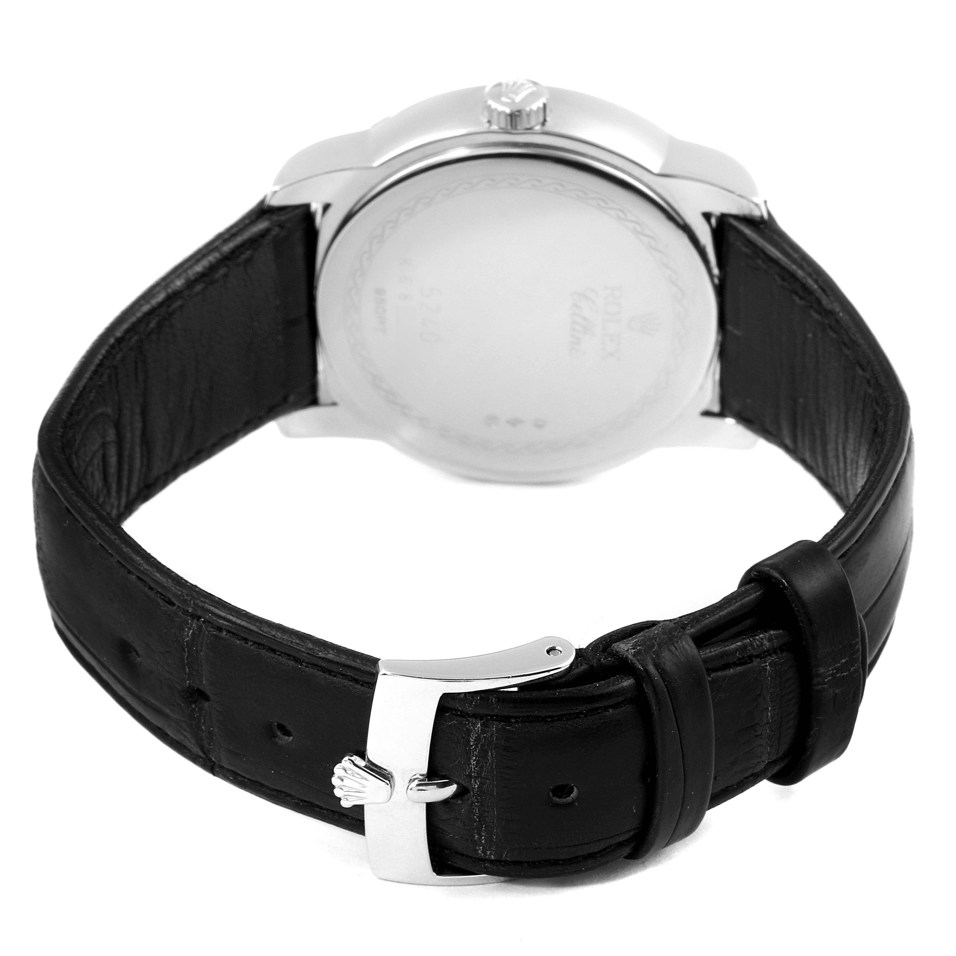 The image shows the back view of a Rolex Cellini 5240 Men's Platinum Mother of Pearl Dial 5240 Men's Platinum Mother of Pearl Dial watch, highlighting its black leather strap and buckle.