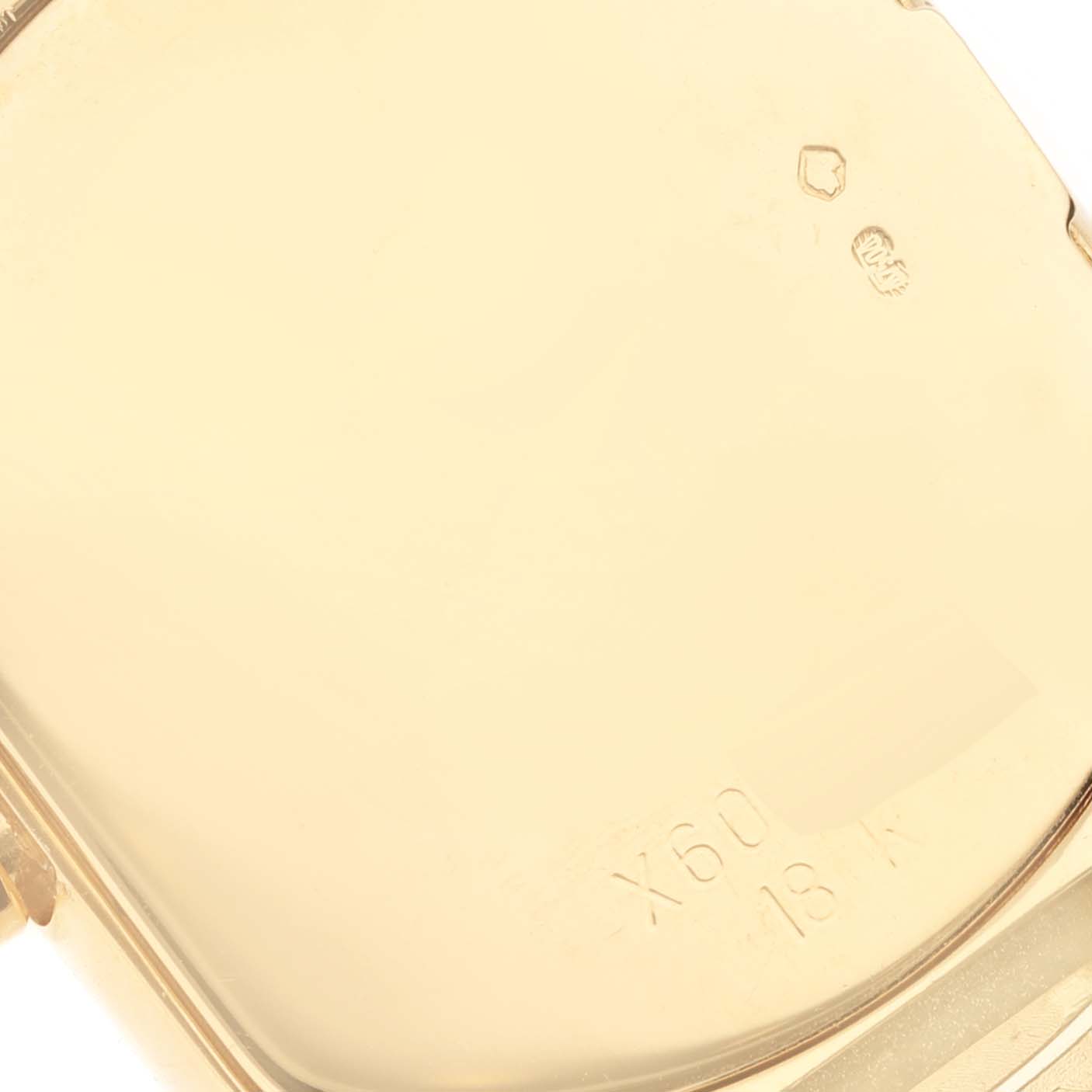 This image shows a close-up of the back of a Rolex Cellini 6631 Women's Yellow Gold Black Dial 6631 Women's Yellow Gold Black Dial watch, highlighting the engravings and hallmarks.