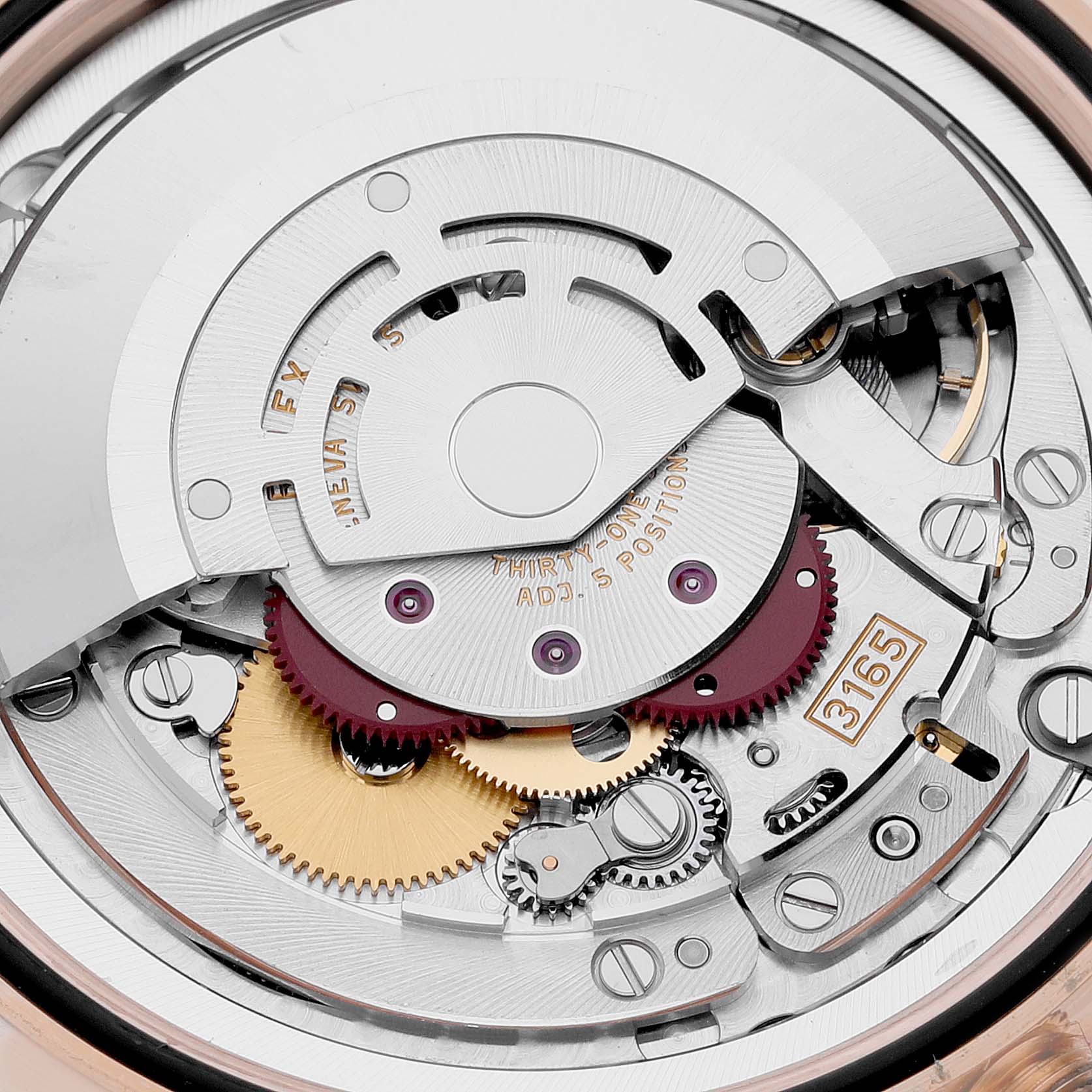 This close-up image of the Rolex Cellini 50515 Men's Rose Gold Black Dial 50515 Men's Rose Gold Black Dial watch shows its intricate mechanical movement and gear mechanism.