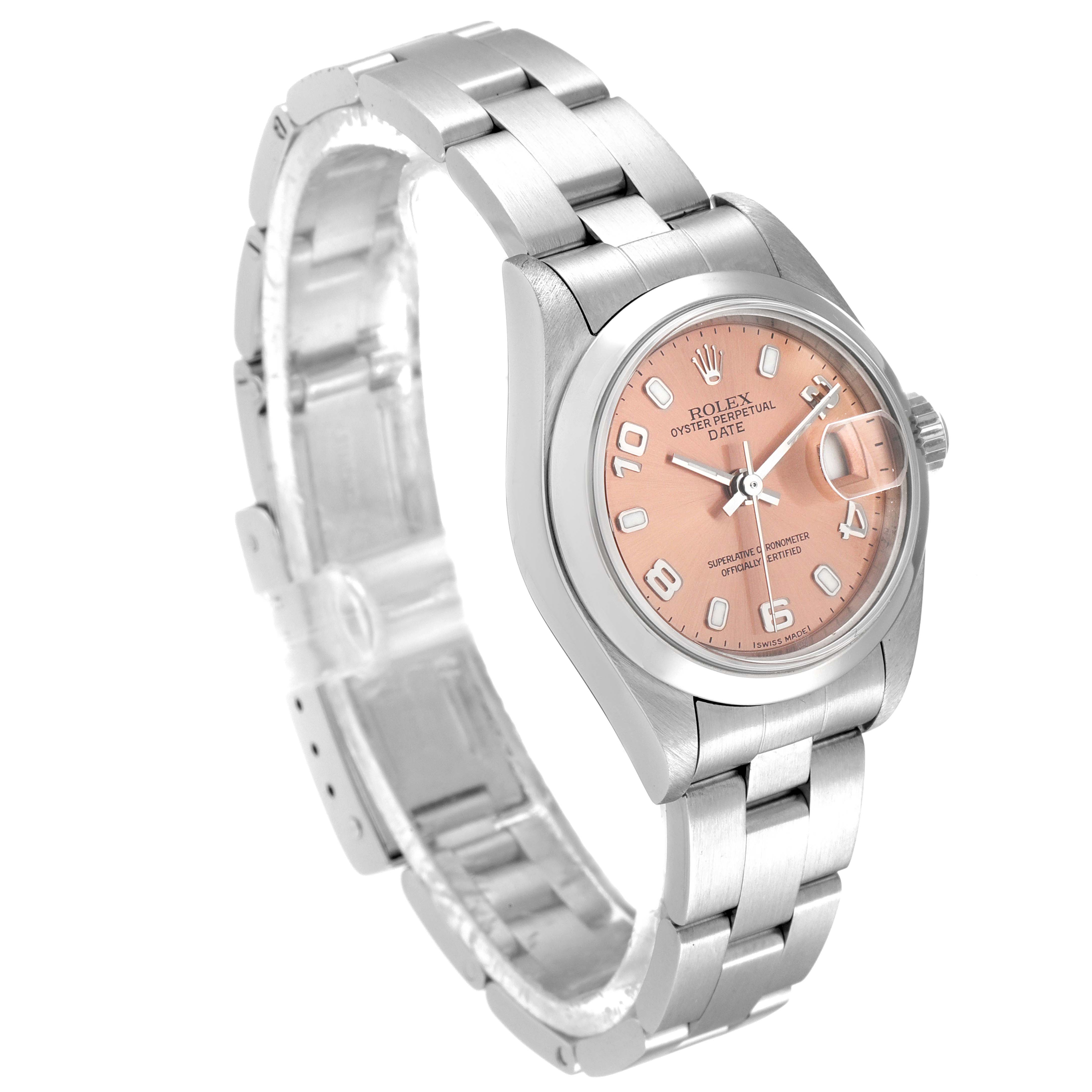The Rolex Date 79160 Women
s Stainless Steel Pink Dial 79160 Women
s Stainless Steel Pink Dial model watch is shown at an angle displaying its pink dial, metal bracelet, and cyclops lens over the date window.