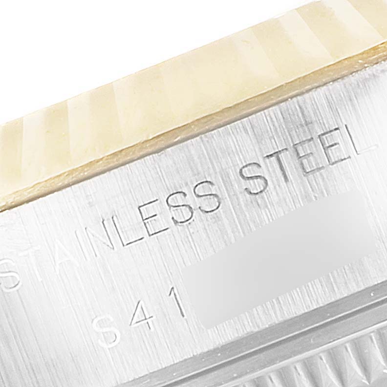 This image shows a close-up angle of the stainless steel casing and fluted bezel of a Rolex Datejust 69173 Women
s Steel and Gold (two tone) Champagne Dial 69173 Women
s Steel and Gold (two tone) Champagne Dial watch.